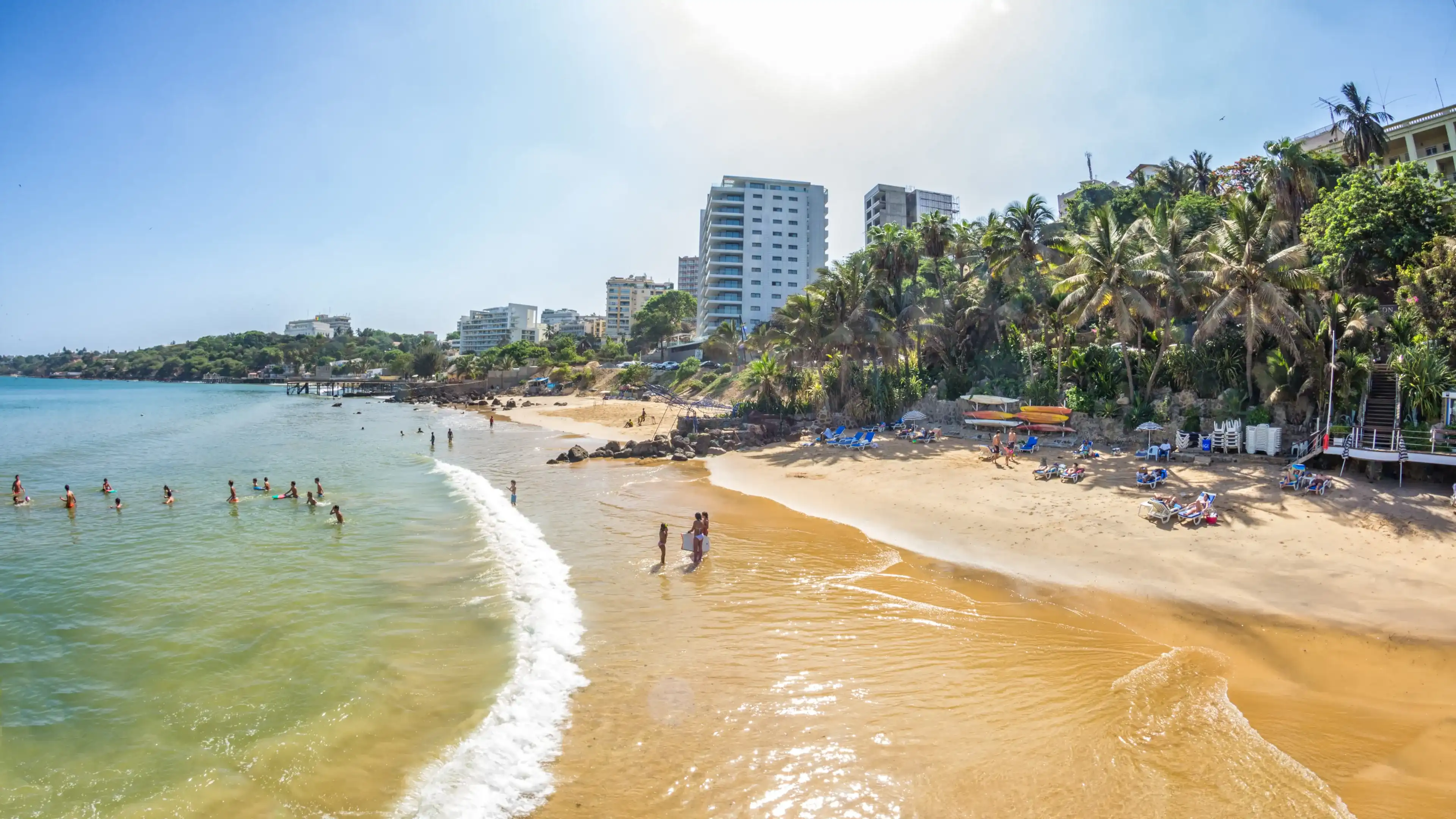Dakar, Senegal - July 2014: Tourists and the local residents of Dakar spend their holidays on the beautiful beaches on July 11, 2014 in Dakar, Senegal Dakar, Senegal - July 2014: Tourists and the local residents of Dakar spend their holidays on the beautiful beaches on July 11, 2014 in Dakar, Senegal