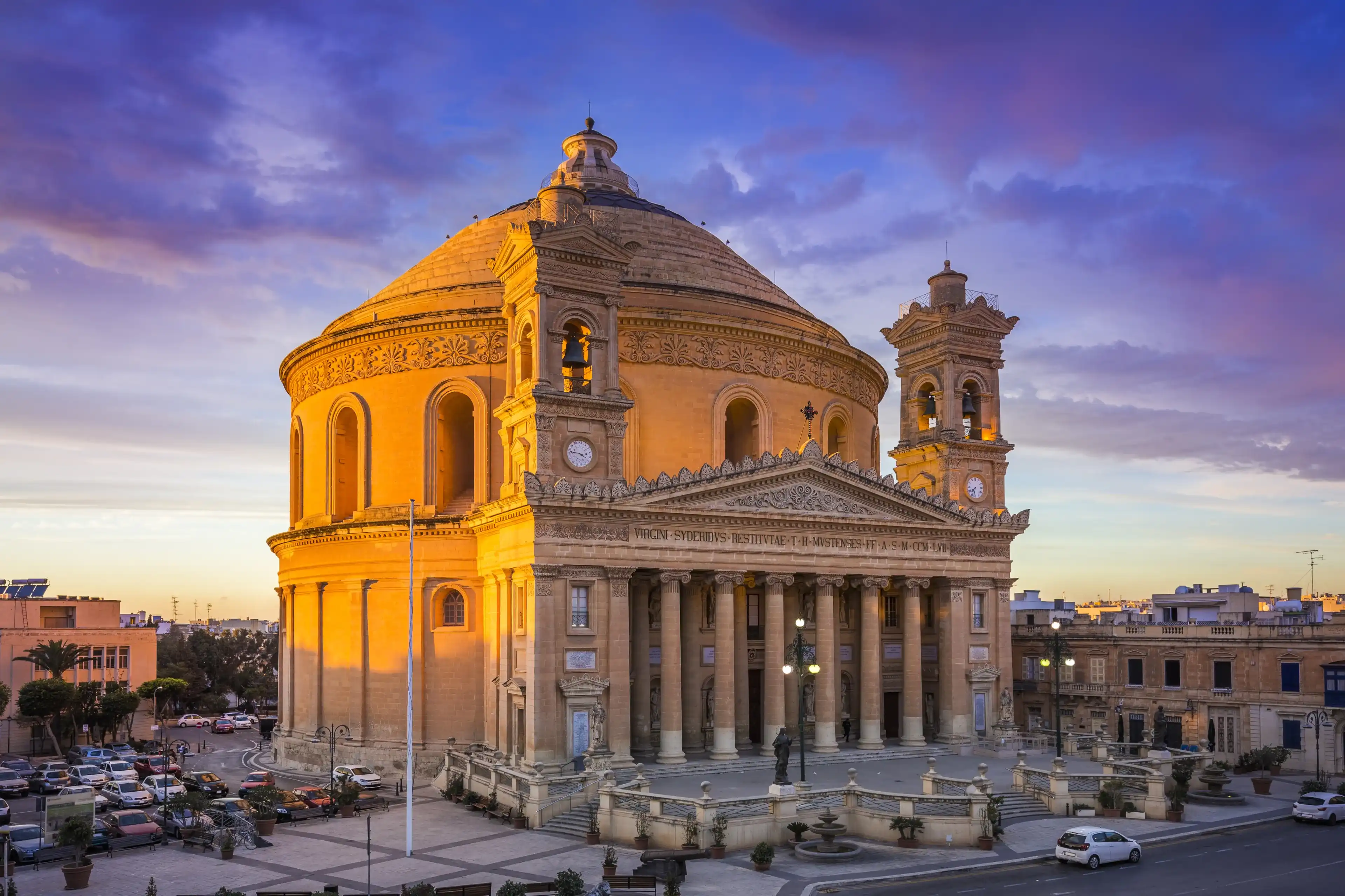 Malta - The famous Mosta Dome at sunset with beautiful sky and clouds Malta - The famous Mosta Dome at sunset with beautiful sky and clouds