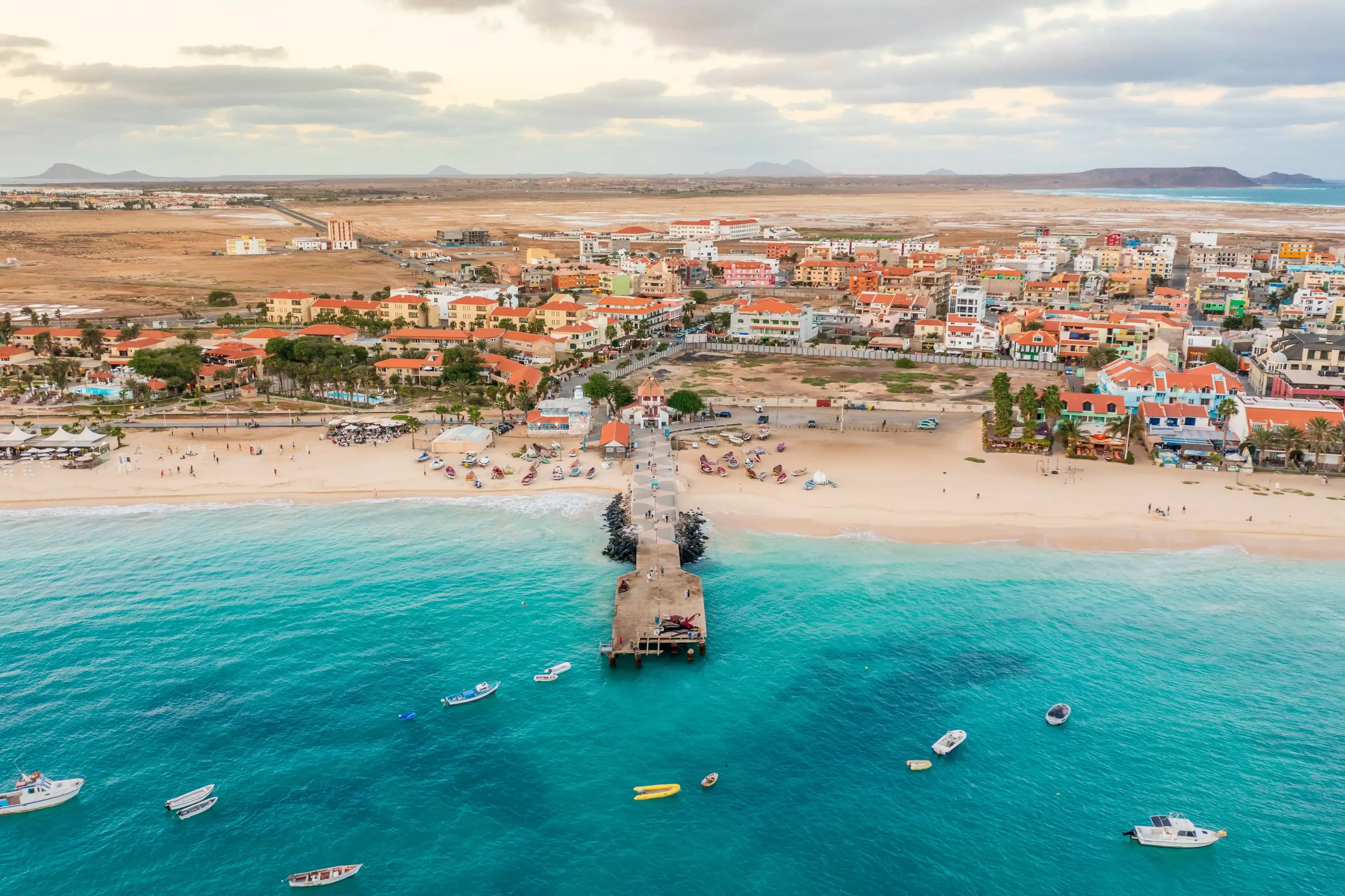 Pier and boats on turquoise water in city of Santa Maria, Sal, Cape Verde Pier and boats on turquoise water in city of Santa Maria, Sal, Cape Verde