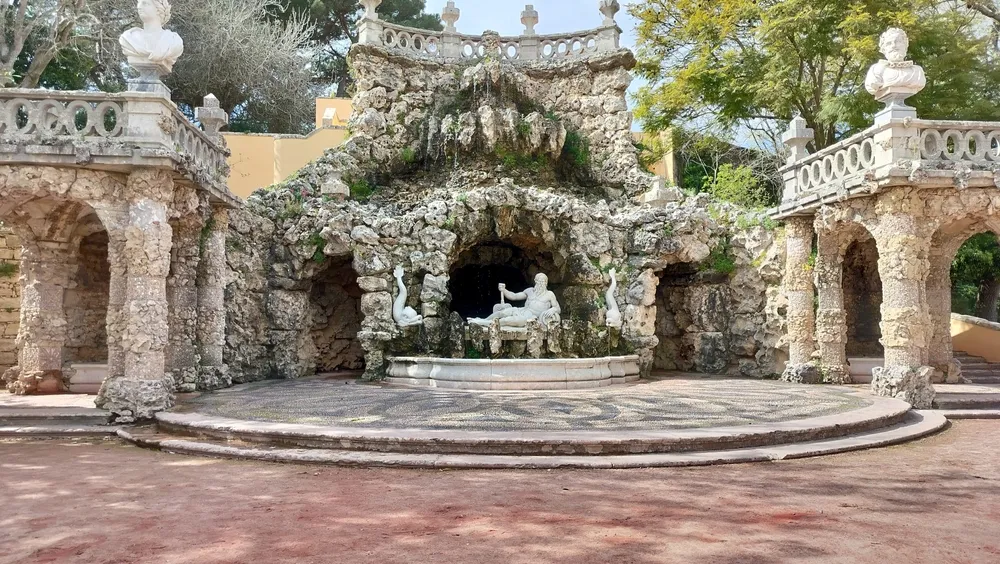 Oeiras, Lisbon, Portugal - March 5, 2024: Poets Waterfall Fountain, Cascata dos Poetas, in the gardens of Marques de Pombal Palace, 18th-century Baroque and Rococo architectural monument