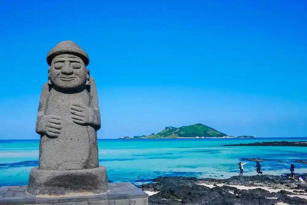Stone Grandfather and beautiful sea scenery - Jeju Island, South Korea. Stone Grandfather and beautiful sea scenery - Jeju Island, South Korea.