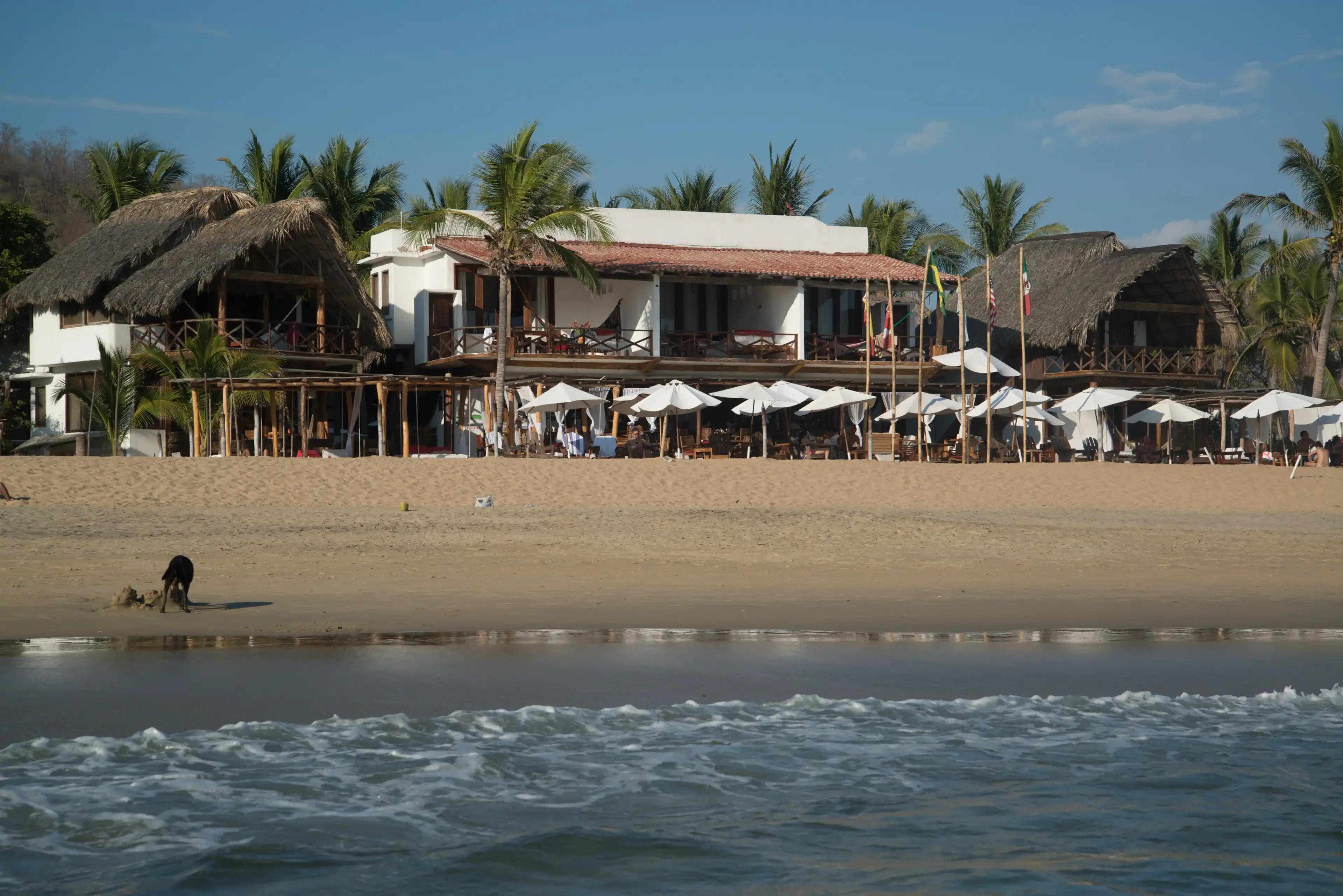 Puerto Escondido, Mexico, circa feb. 2017: Playa Zipolite, beach community in San Pedro Pochutla municipality on the southern coast of Oaxaca state in Mexico between Huatulco and Puerto Escondido. Puerto Escondido, Mexico, circa feb. 2017: Playa Zipolite, beach community in San Pedro Pochutla municipality on the southern coast of Oaxaca state in Mexico between Huatulco and Puerto Escondido.