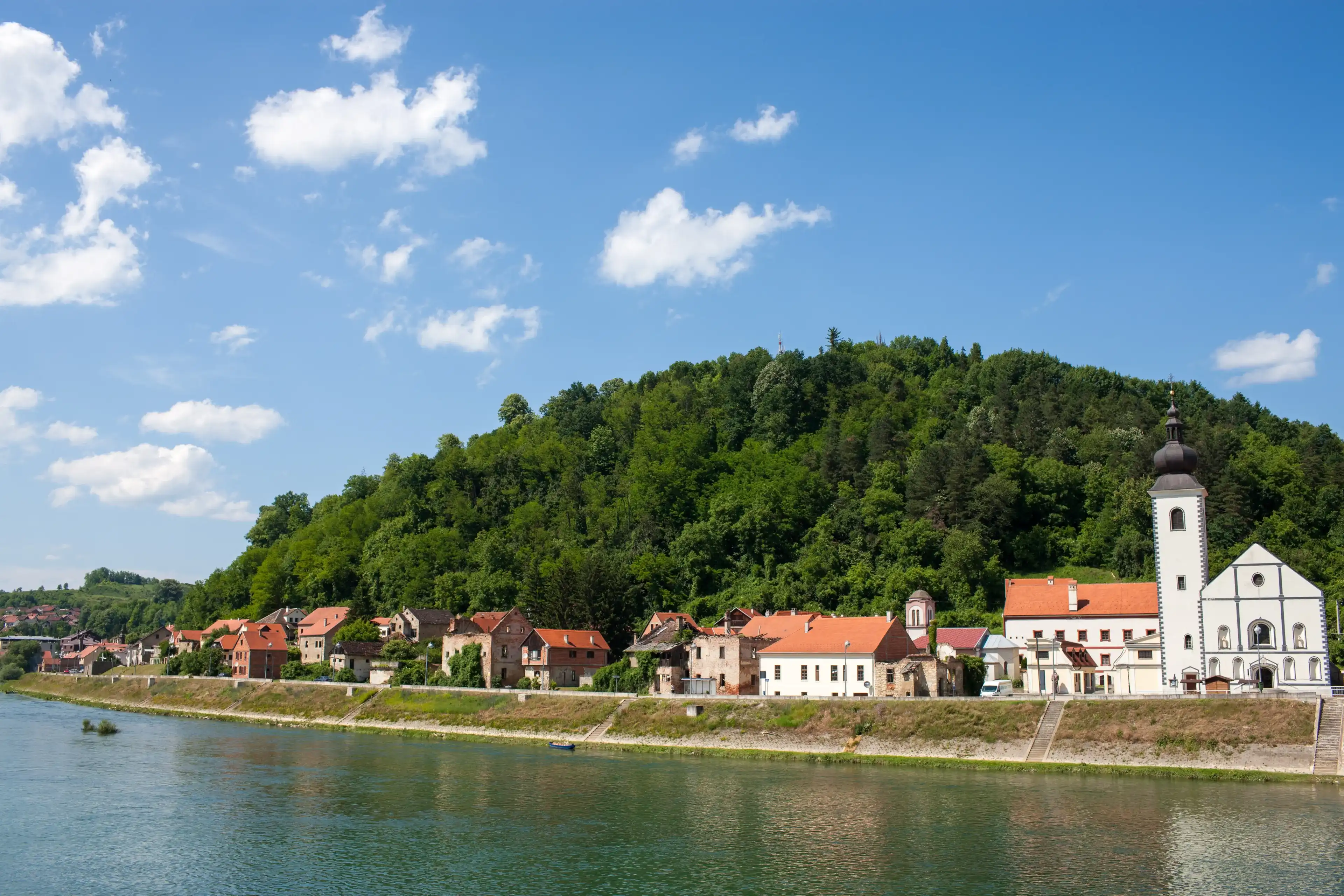 HRVATSKA KOSTAJNICA, CROATIA - June 9, 2013: Small town Hrvatska Kostajnica in central Croatia, located on the river Una in the Sisak-Moslavina county. HRVATSKA KOSTAJNICA, CROATIA - June 9, 2013: Small town Hrvatska Kostajnica in central Croatia, located on the river Una in the Sisak-Moslavina county.