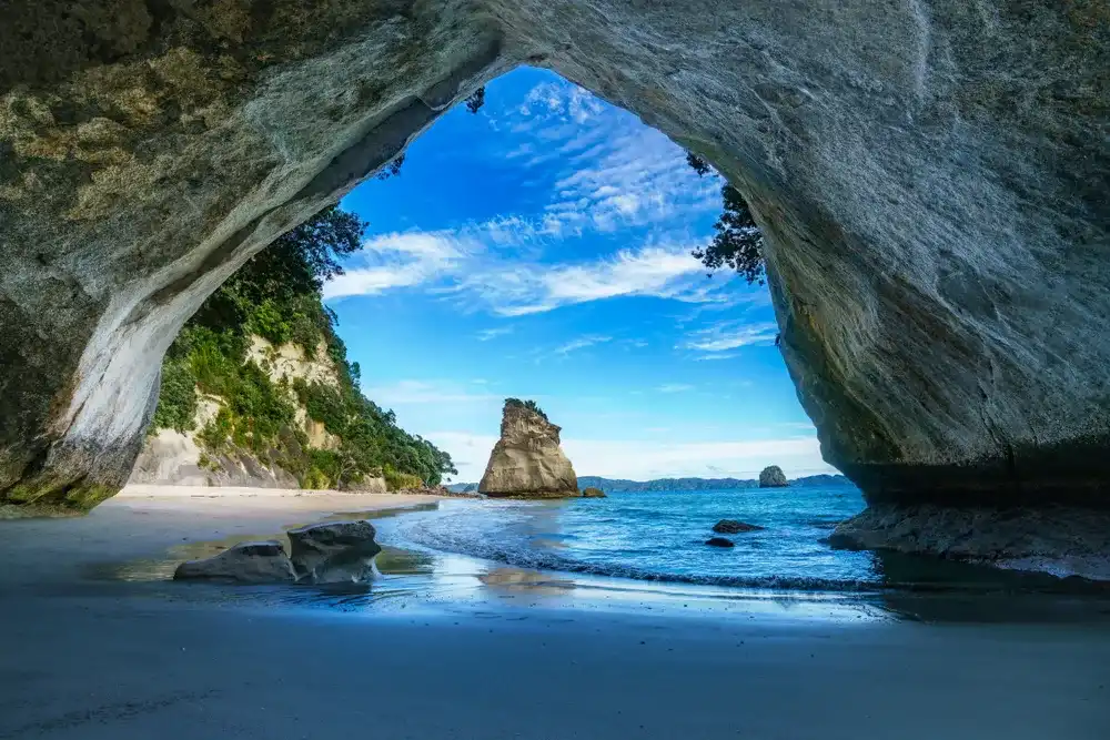 view from the cave at cathedral cove beach,coromandel,new zealand view from the cave at cathedral cove beach,coromandel,new zealand