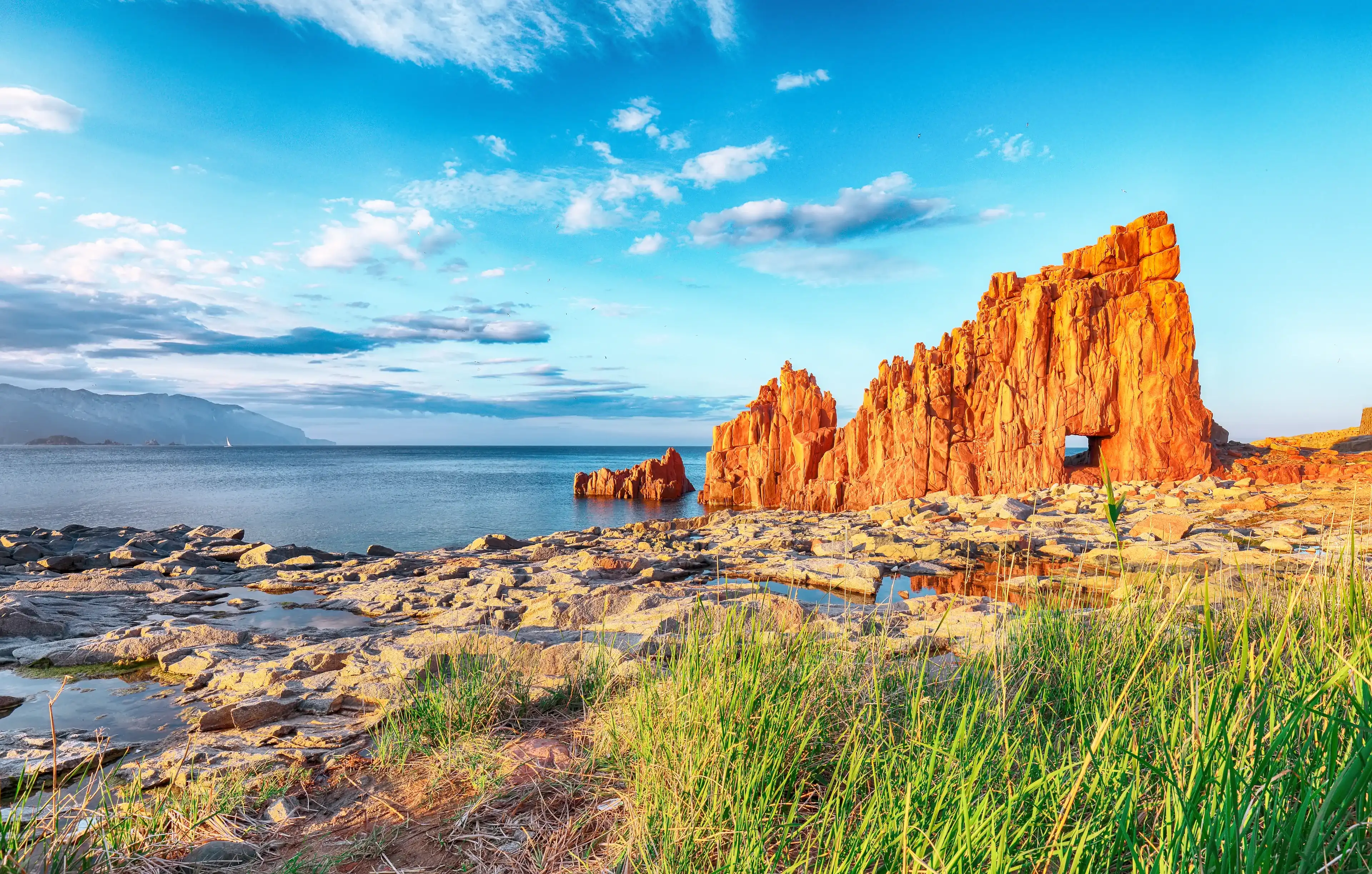 Awesome sunset view of Red Rocks (called "Rocce Rosse") in Arbatax. Location: ArbAwesome sunset view of Red Rocks (called "Rocce Rosse") in Arbatax. Location: Arbatax, Province of Ogliastra, Capo Bellavista, Sardinia, Italy, Europeatax, Province of Ogliastra, Capo Bellavista, Sardinia, Italy, Europe Awesome sunset view of Red Rocks (called "Rocce Rosse") in Arbatax. Location: ArbAwesome sunset view of Red Rocks (called "Rocce Rosse") in Arbatax. Location: Arbatax, Province of Ogliastra, Capo Bellavista, Sardinia, Italy, Europeatax, Province of Ogliastra, Capo Bellavista, Sardinia, Italy, Europe