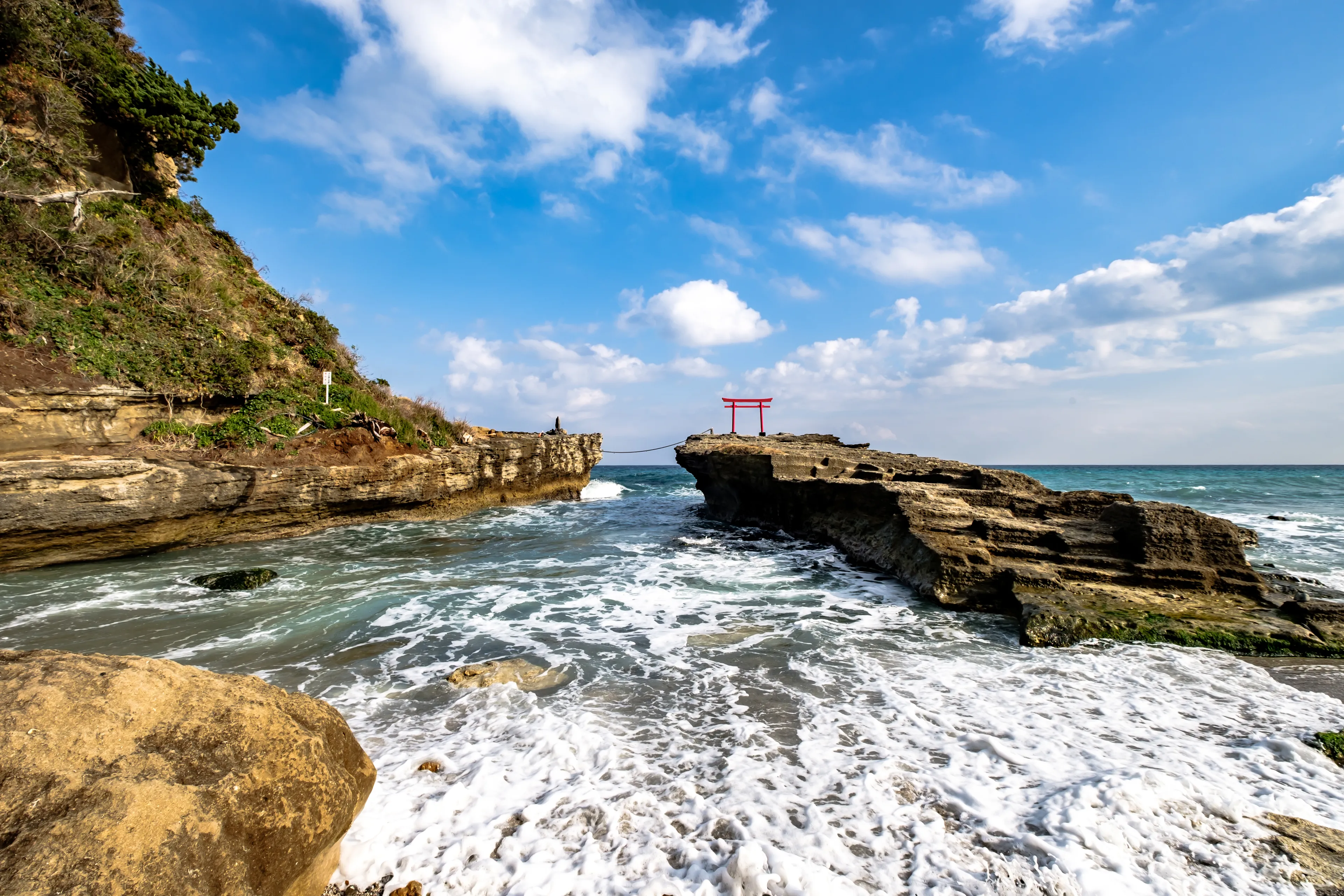 Shirahama Jinja Shrine Torii on the cliff by the shore in Izu Peninsula, Shizuoka, Japan