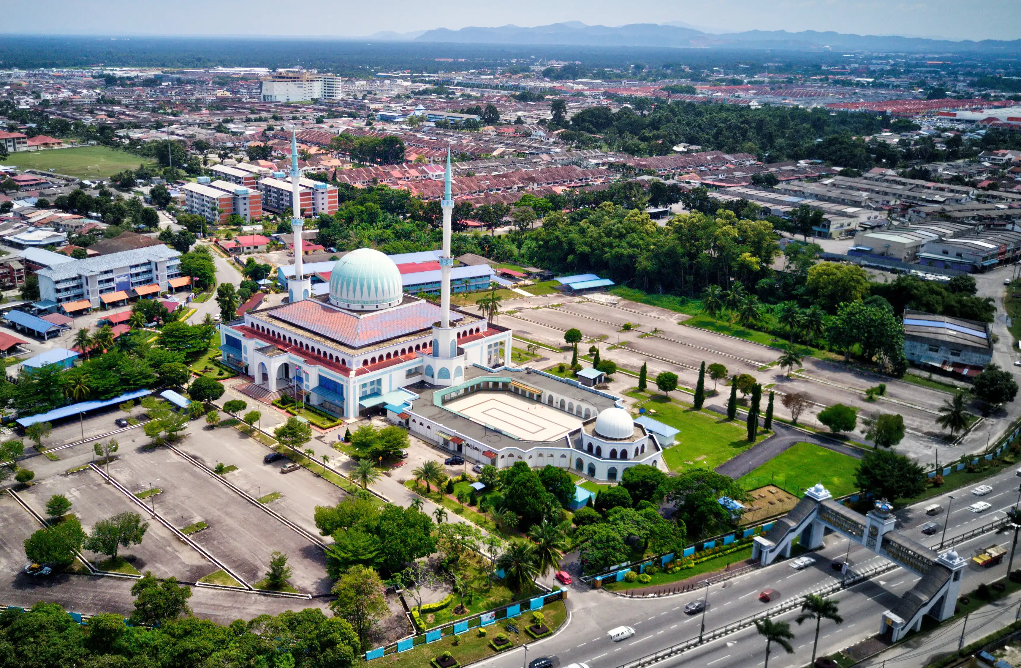 Muslim Mosque in aerial shot in Batu Pahat, Johor under the sunny day. Muslim Mosque in aerial shot in Batu Pahat, Johor under the sunny day.