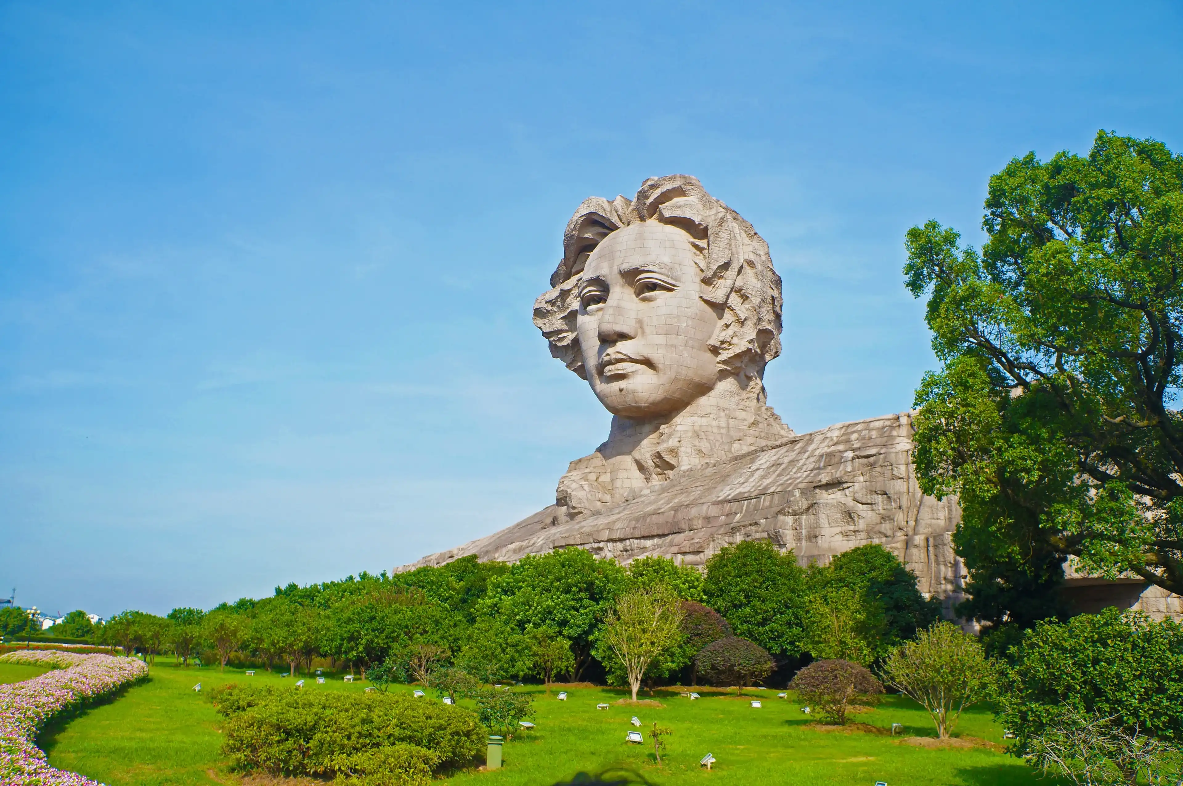 Changsha, China - Sep 25, 2017 : Youth Mao Zedong statue is located in Orange Isle. Changsha City, Hunan Province Changsha, China - Sep 25, 2017 : Youth Mao Zedong statue is located in Orange Isle. Changsha City, Hunan Province