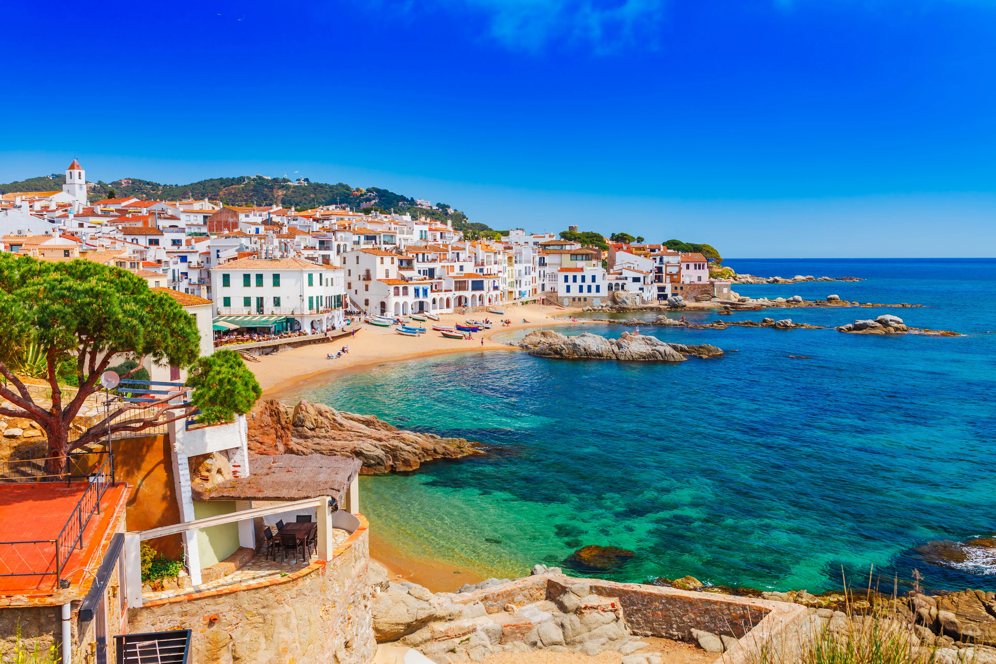 Sea landscape with Calella de Palafrugell, Catalonia, Spain near of Barcelona. Scenic fisherman village with nice sand beach and clear blue water in nice bay. Famous tourist destination in Costa Brava