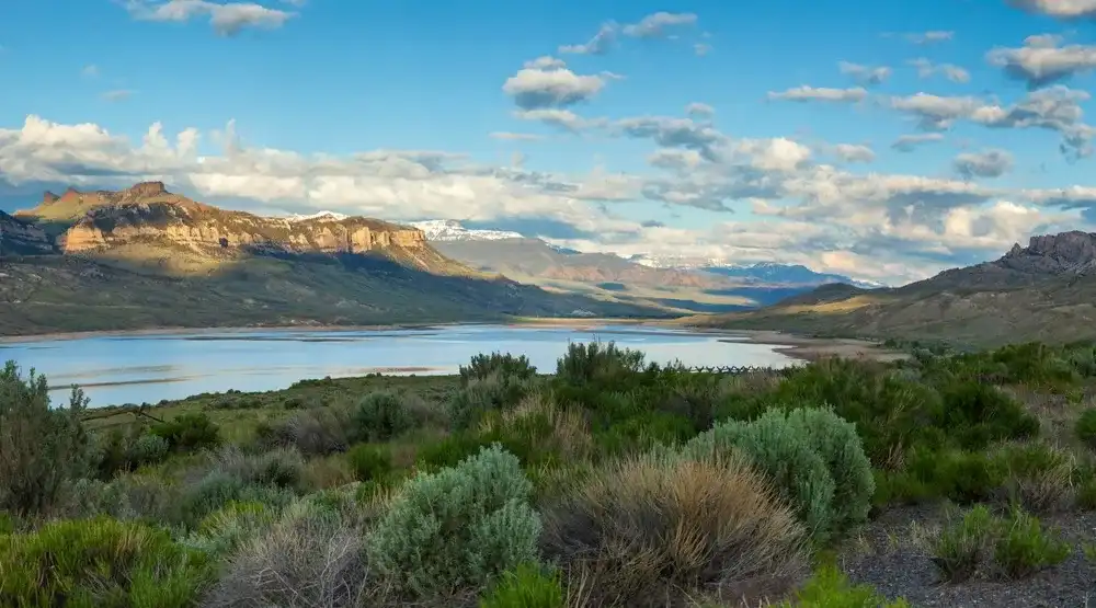 Panorama of the Absaroka Mountains of Wyoming above the Buffalo Bill Reservoir on a bright summer morning Panorama of the Absaroka Mountains of Wyoming above the Buffalo Bill Reservoir on a bright summer morning