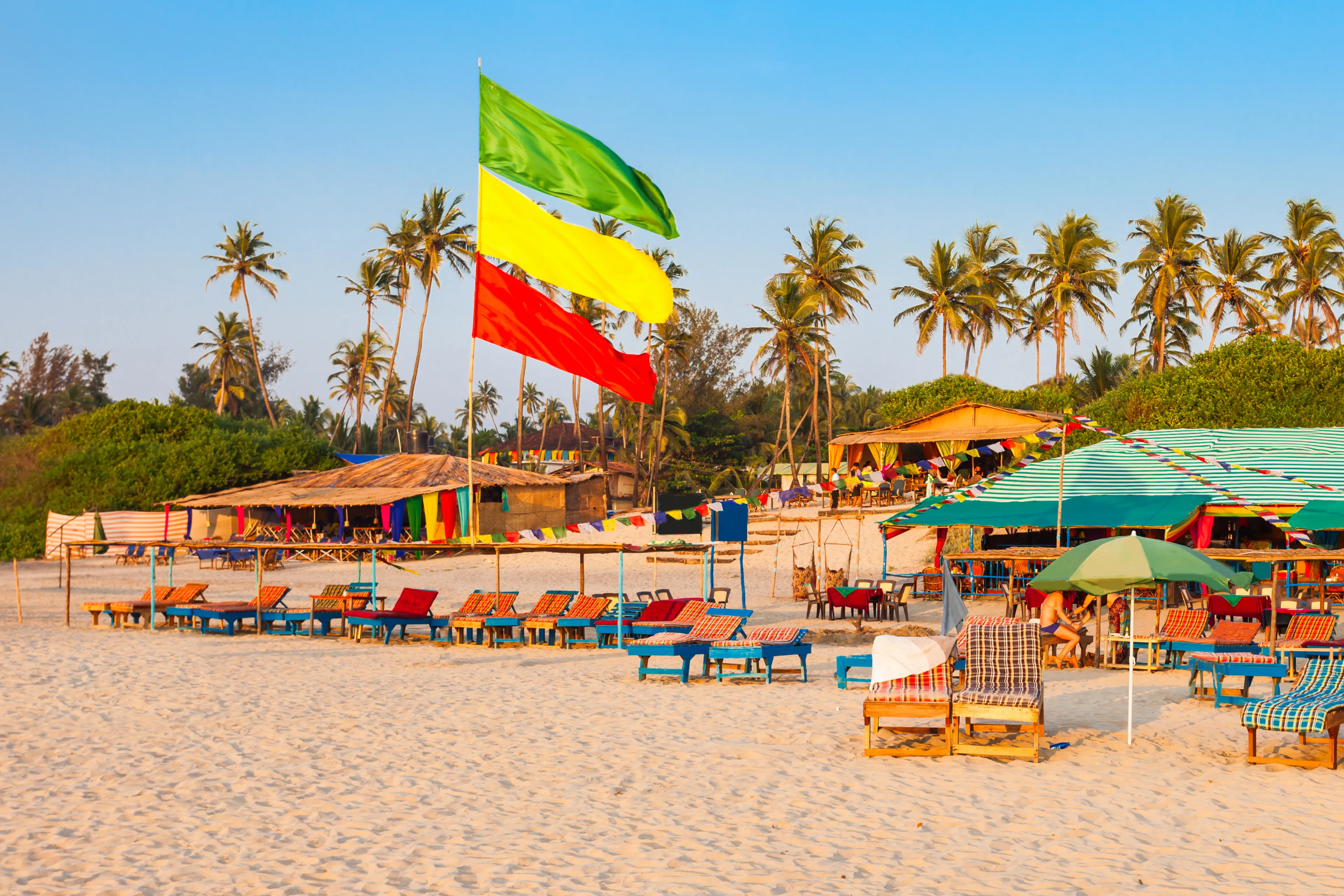 Beach restaurant shacks and sunbeds on Arambol beach in north Goa, India
