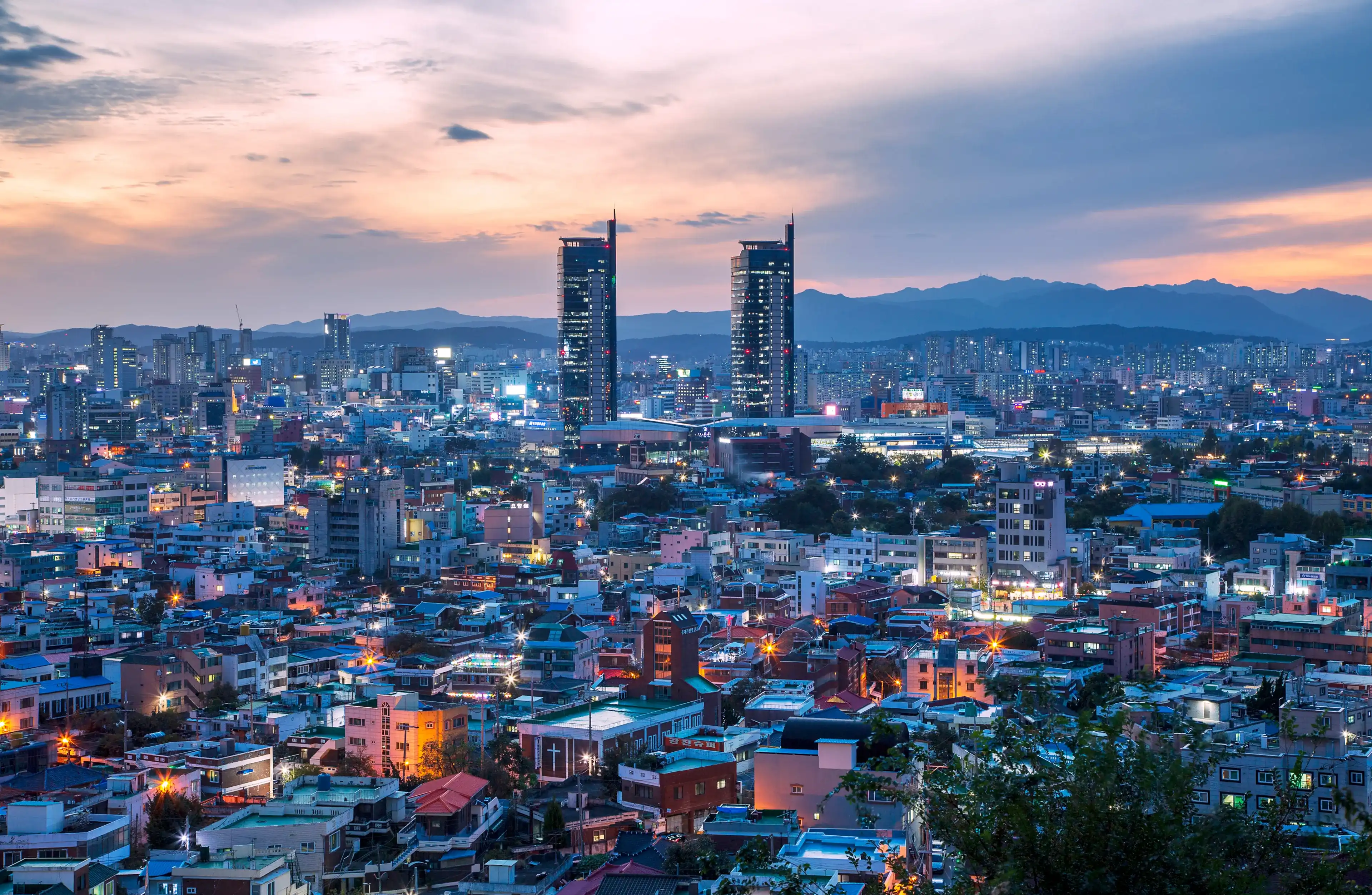 Don-gu, Daejeon, South Korea - October 5, 2020: Sunset and night view of downtown Daejeon with houses and highrise apartments seen from Daedong Sky Park Don-gu, Daejeon, South Korea - October 5, 2020: Sunset and night view of downtown Daejeon with houses and highrise apartments seen from Daedong Sky Park