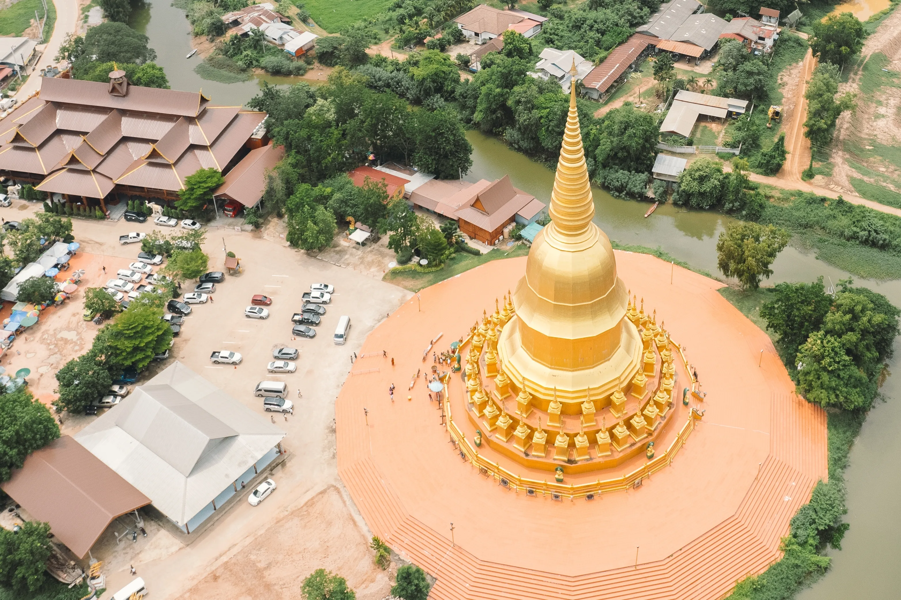 Golden Chedi and Naga Sculpture at Wat Pa Wang Nam Yen, Maha Sarakham, Thailand