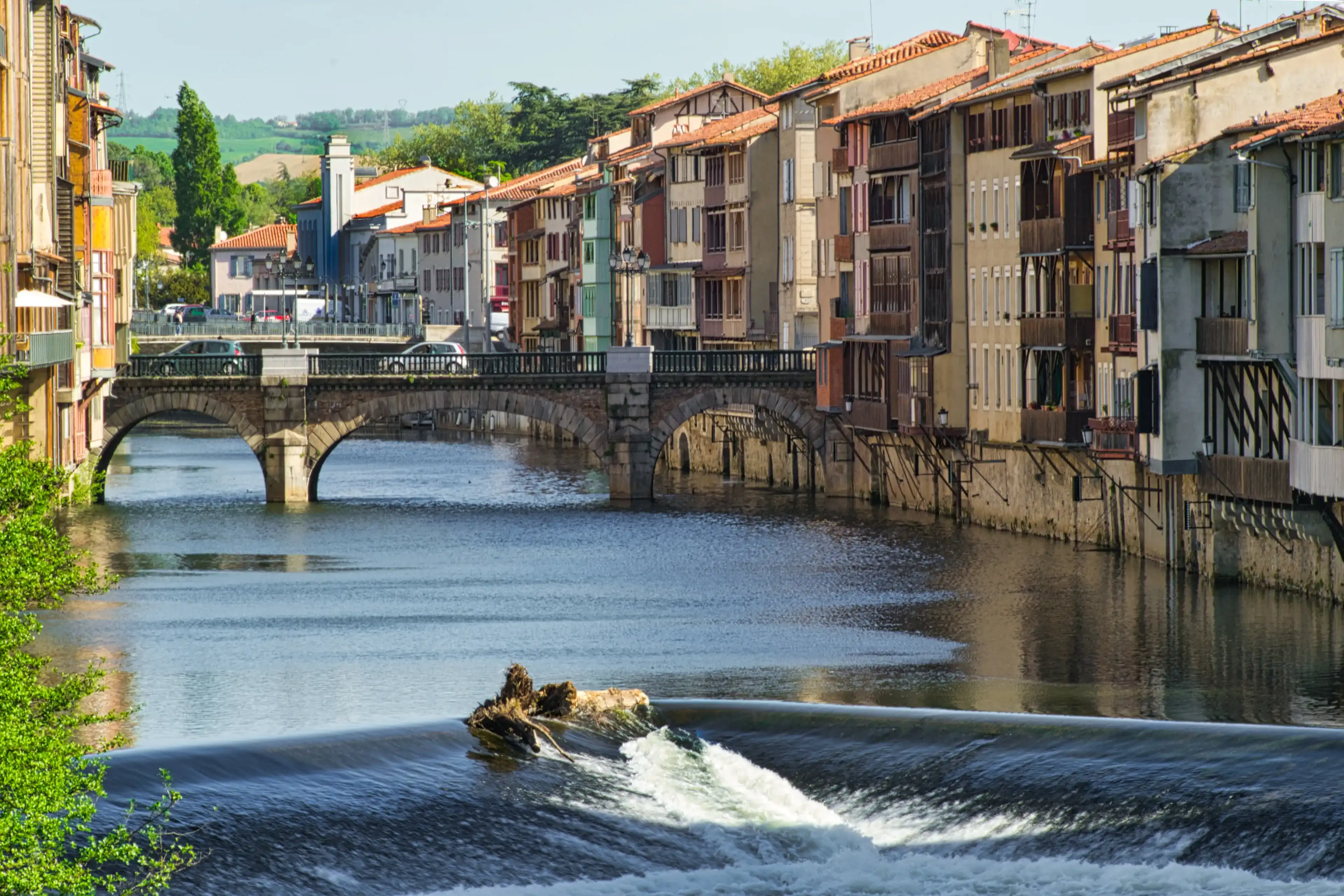 Agout river in Castres, France, showing the old tanners' houses on the bank Agout river in Castres, France, showing the old tanners' houses on the bank