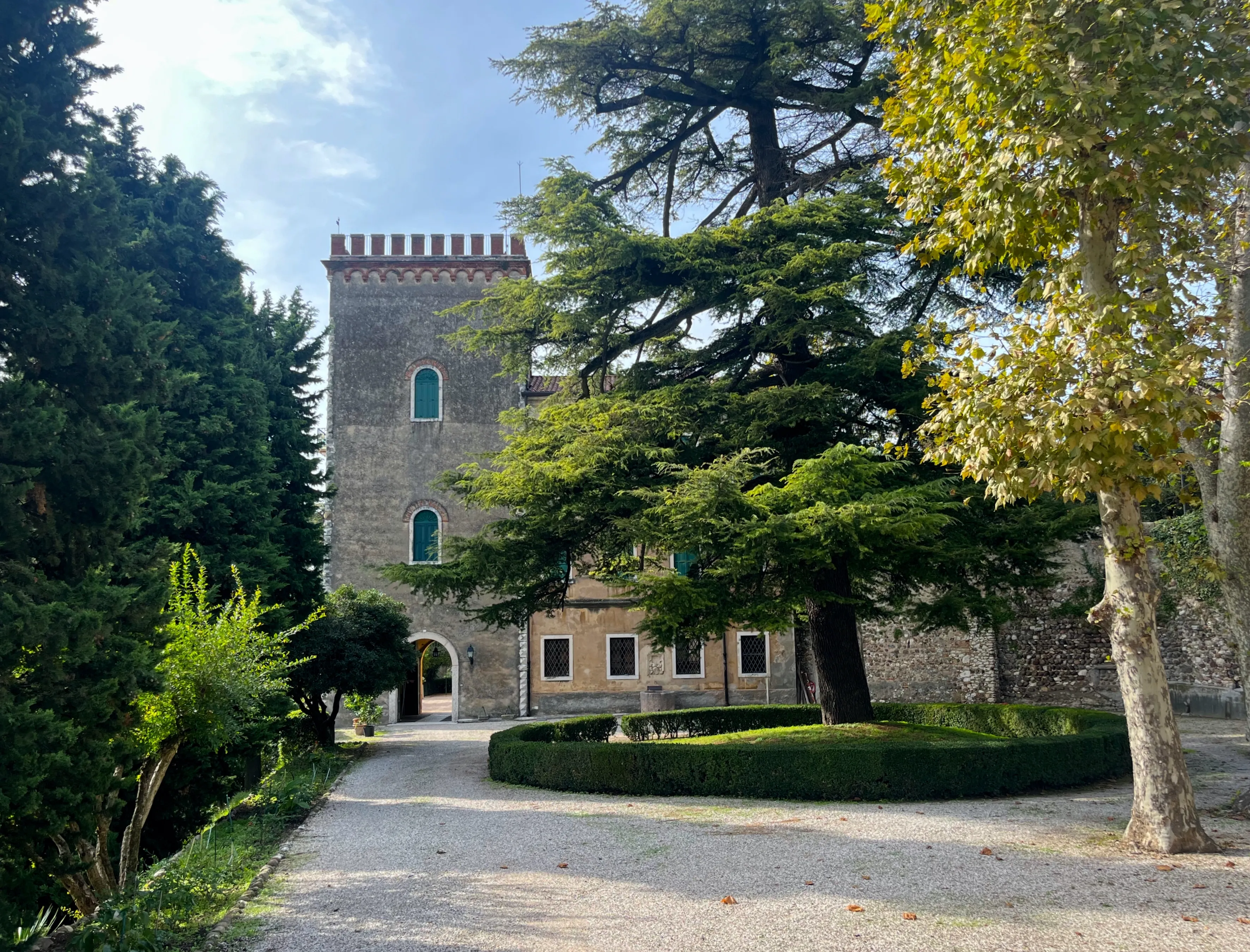 Cavaion Veronese, Italy - 10.13.2024: Tower in Cavaion Veronese VR, Italy. Historical building surrounded by greenery and gardens, unique architectural style