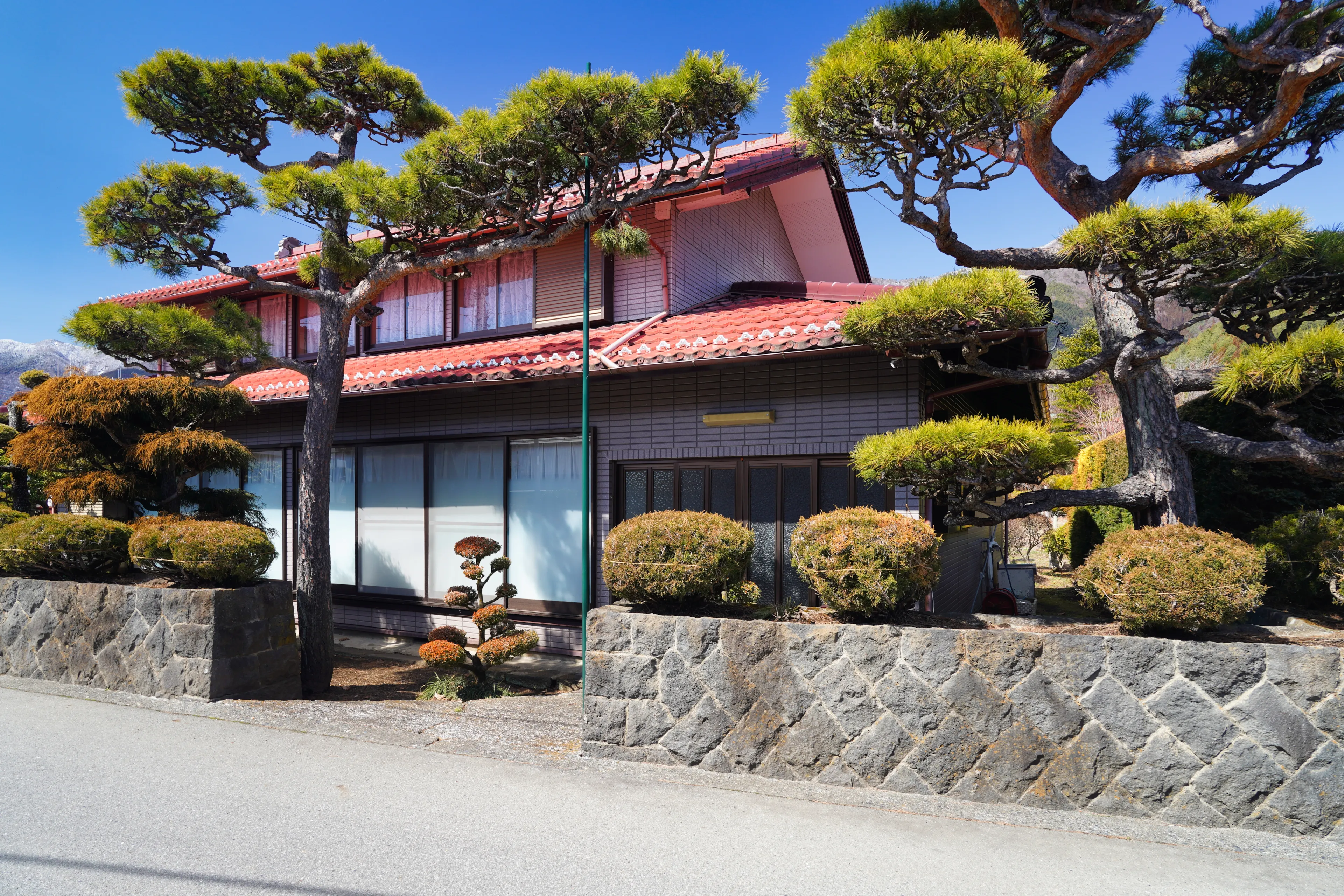 Fujikawaguchiko, Japan - March 13, 2024: Narrow streets and houses in Fujikawaguchiko.