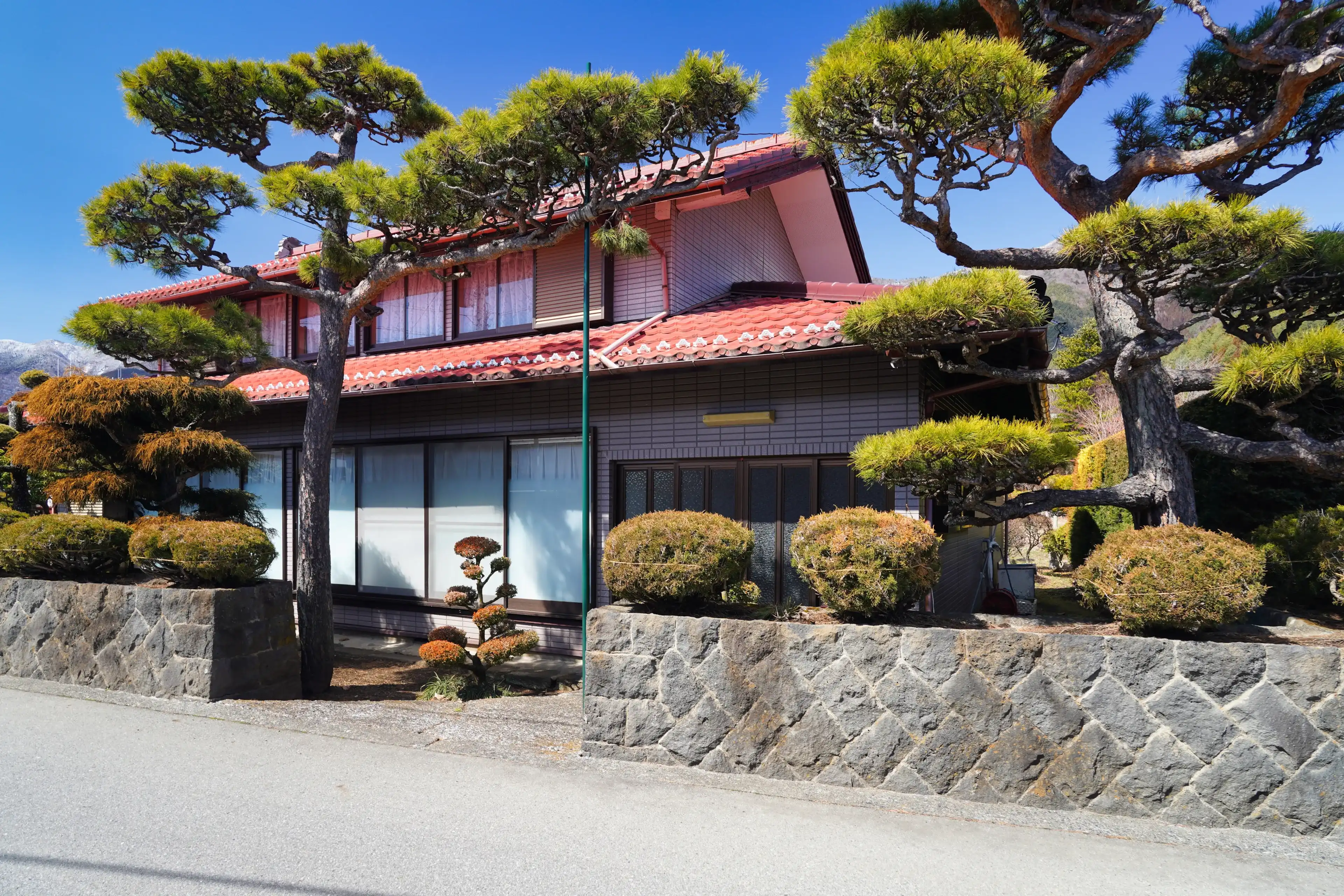 Fujikawaguchiko, Japan - March 13, 2024: Narrow streets and houses in Fujikawaguchiko. Fujikawaguchiko, Japan - March 13, 2024: Narrow streets and houses in Fujikawaguchiko.