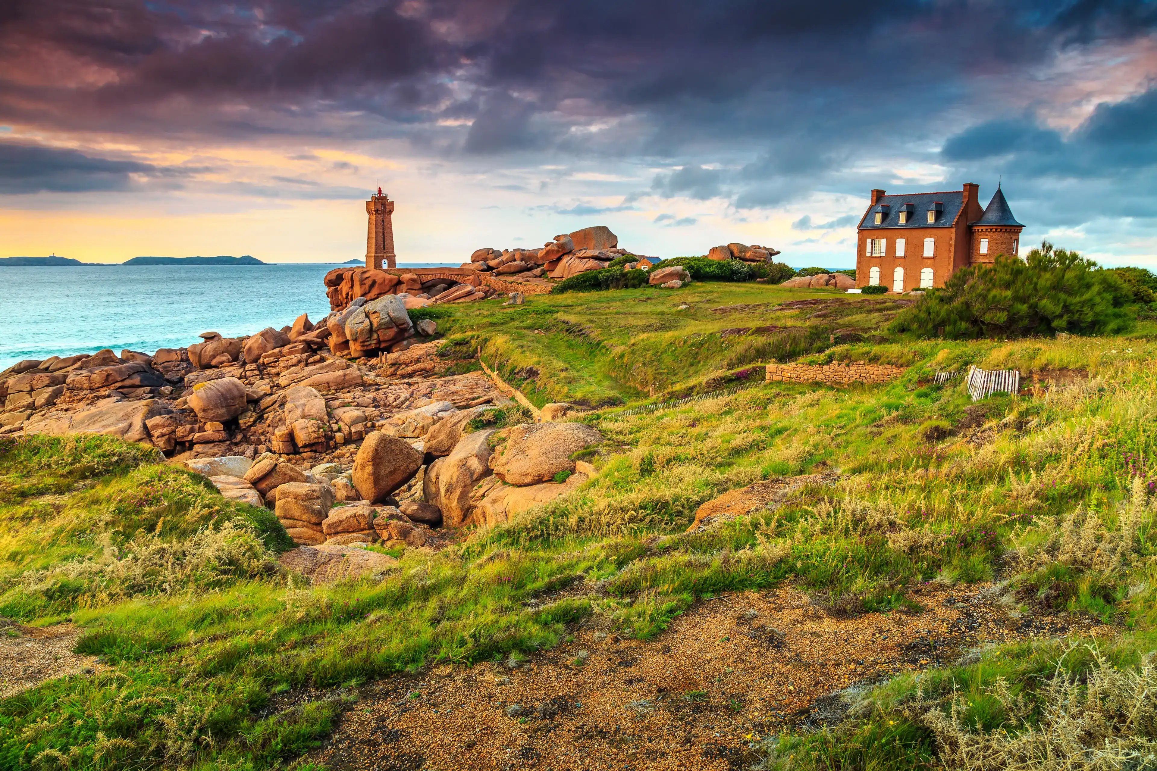 Amazing sunset with lighthouse of Ploumanach Mean Ruz in Perros-Guirec on Pink Granite Coast,Brittany,France,Europe Amazing sunset with lighthouse of Ploumanach Mean Ruz in Perros-Guirec on Pink Granite Coast,Brittany,France,Europe