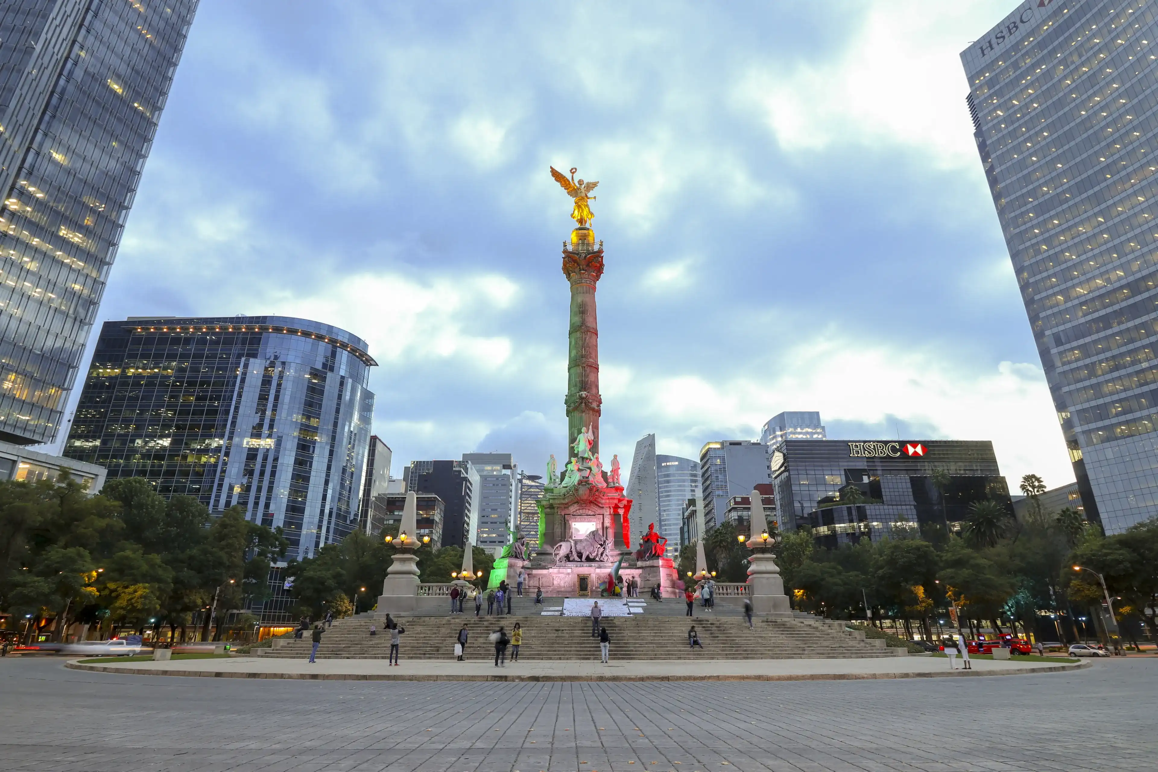 Mexico City, Mexico - September 7, 2017: Monumento a la Independencia, El Angel (Monument to Independence, The Angel) at sunset, in Paseo de la Reforma. Mexico City, Mexico - September 7, 2017: Monumento a la Independencia, El Angel (Monument to Independence, The Angel) at sunset, in Paseo de la Reforma.