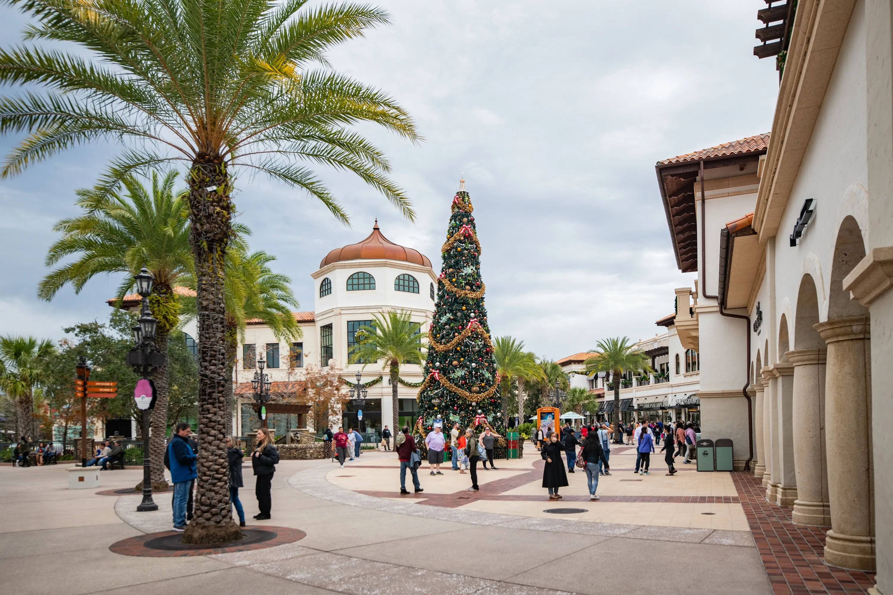 Lake Buena Vista, FL, USA- Jan 8, 2024: Palm tree pedestrian walkway at Disney Springs in Lake Buena Vista, Orlando, Florida decorated for christmas nara the Zara store