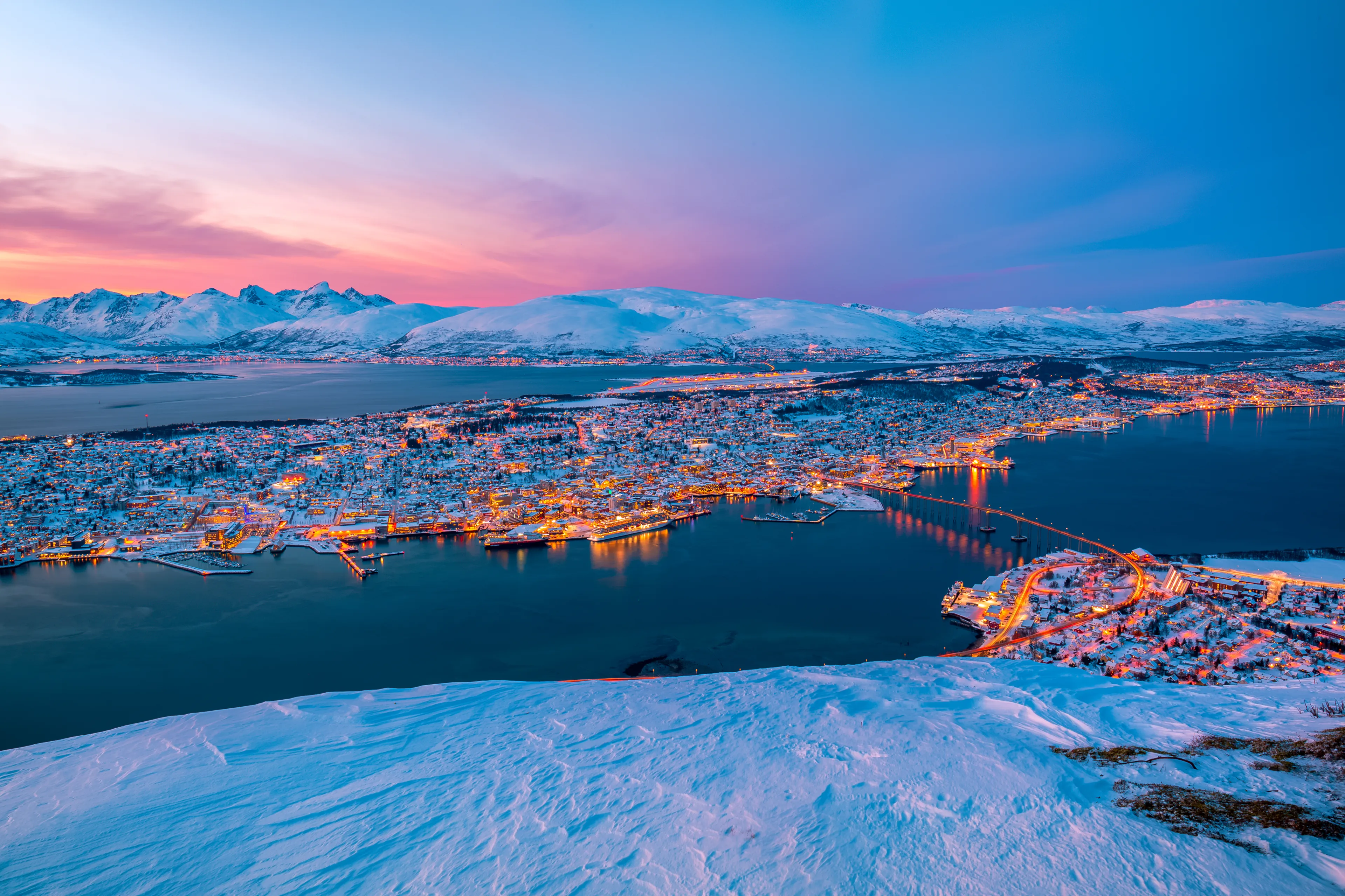 Photo was taken from Tromso,Norway. It was a winter snowy season and the snow make all the place looks different. Tromso sunsets are the most colorful sunsets I ever witnessed