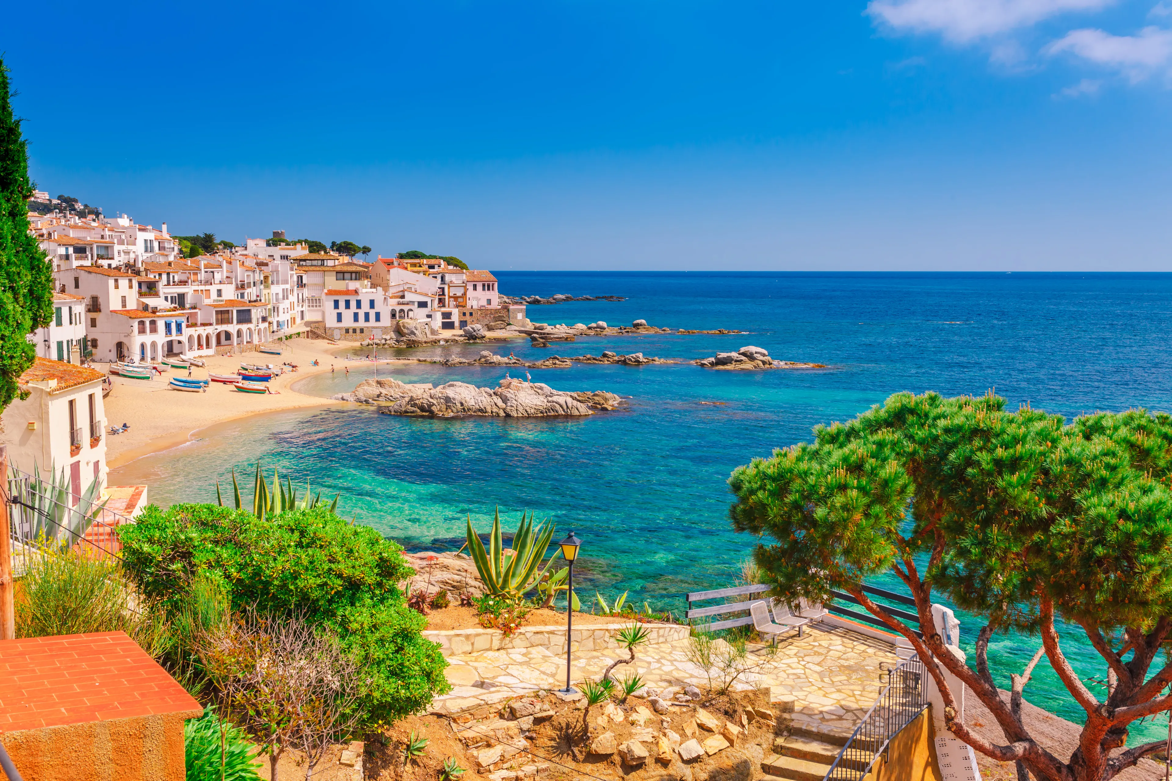 Sea landscape with Calella de Palafrugell, Catalonia, Spain near of Barcelona. Scenic fisherman village with nice sand beach and clear blue water in nice bay. Famous tourist destination in Costa Brava