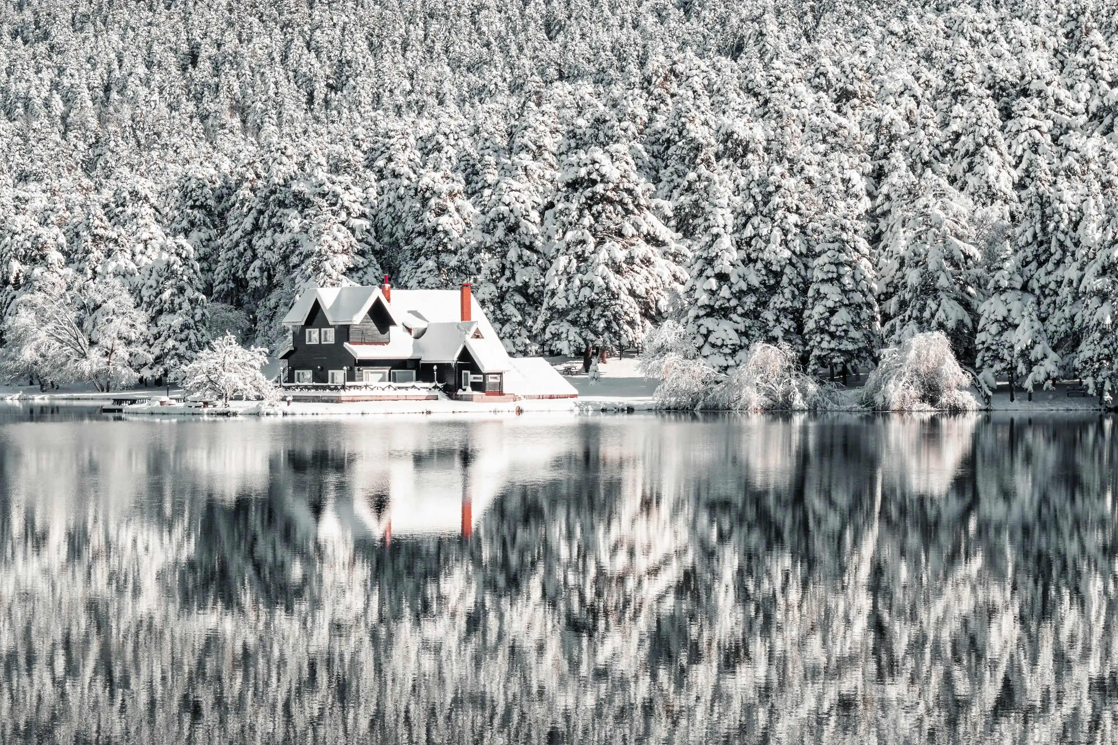 Bolu Golcuk National Park, lake wooden house on a snowy winter day in the forest in Turkey Bolu Golcuk National Park, lake wooden house on a snowy winter day in the forest in Turkey