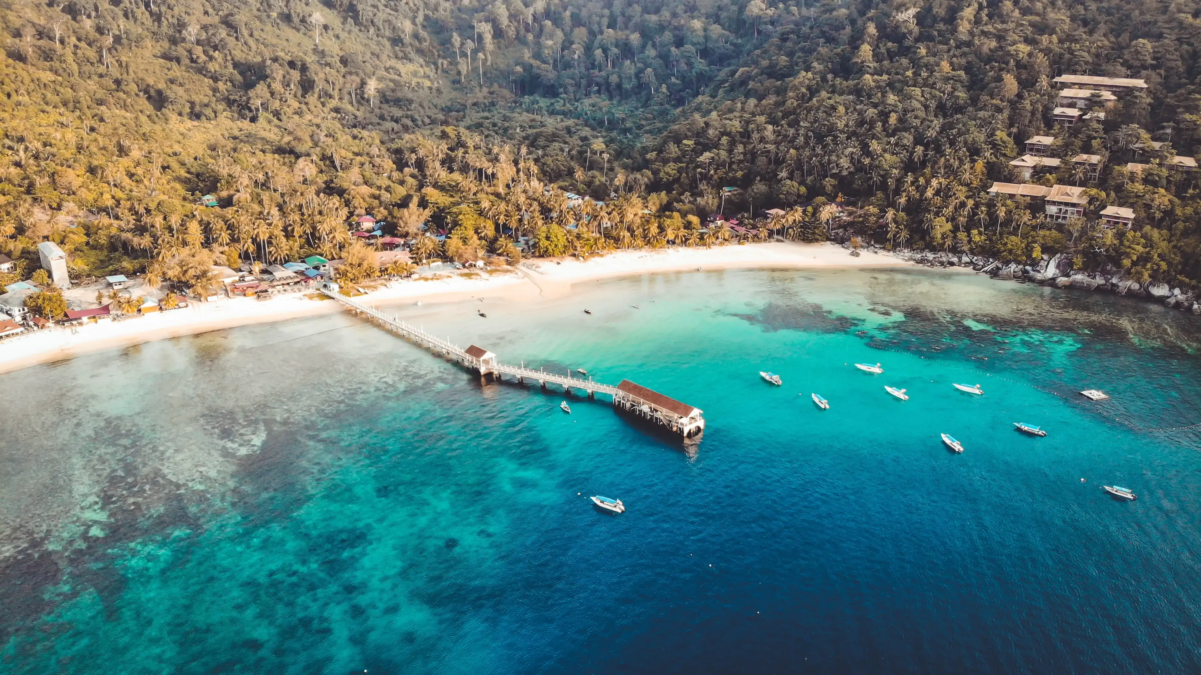 Sunset Salang Village, Kampung Salang Tioman Island, Malaysia with beautiful blue and green ocean Sunset Salang Village, Kampung Salang Tioman Island, Malaysia with beautiful blue and green ocean
