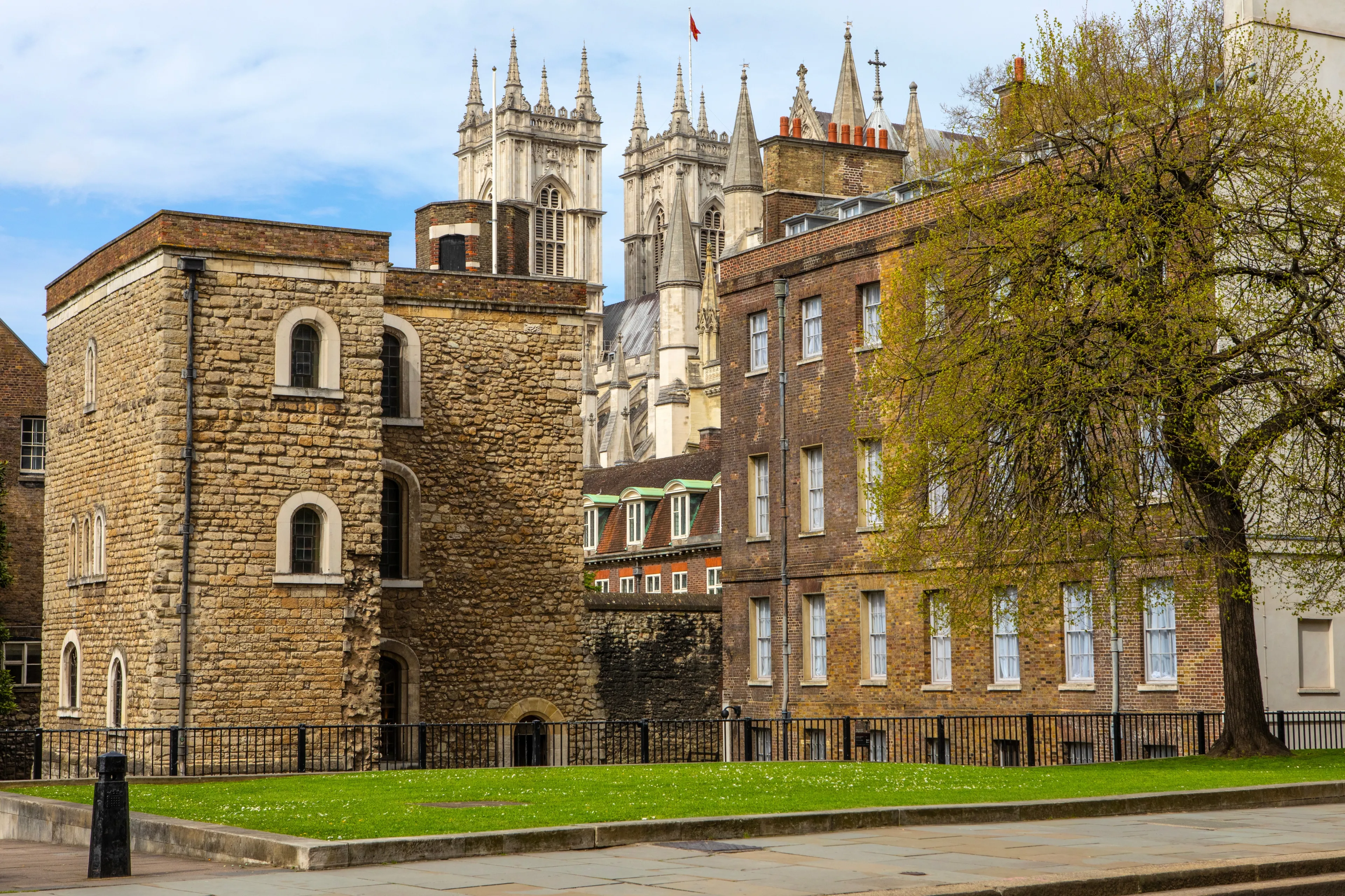 The historic Jewel Tower with Westminster Abbey in the background, in the City of Westminster, London, UK.