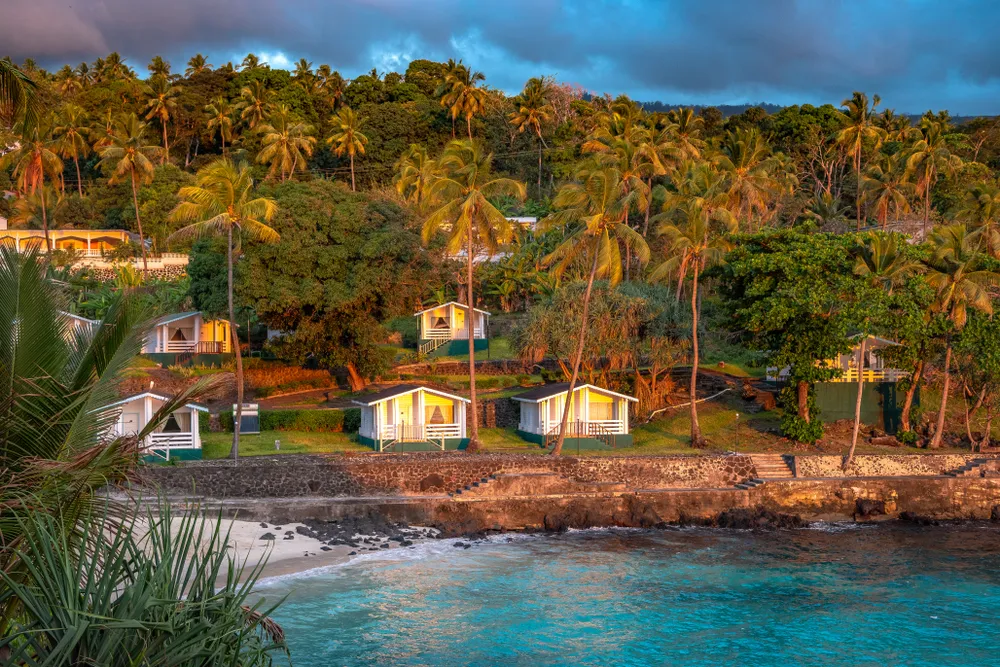 Sunset in holiday paradise resort on Grand Comore island, Comoros. Beautiful sunset light of sun going into the sea. Villas on the beach with private beach. Moroni Comoros, Itsandra beach resort hotel