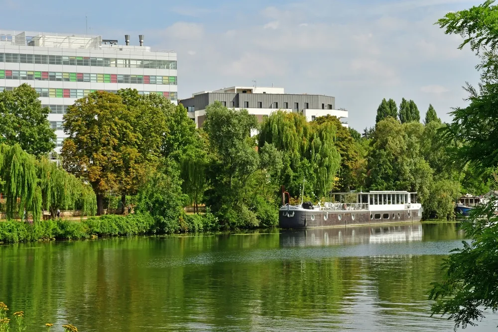 Rueil Malmaison; France - july 26 2022 : the picturesque city view from the middle of thr Seine river 