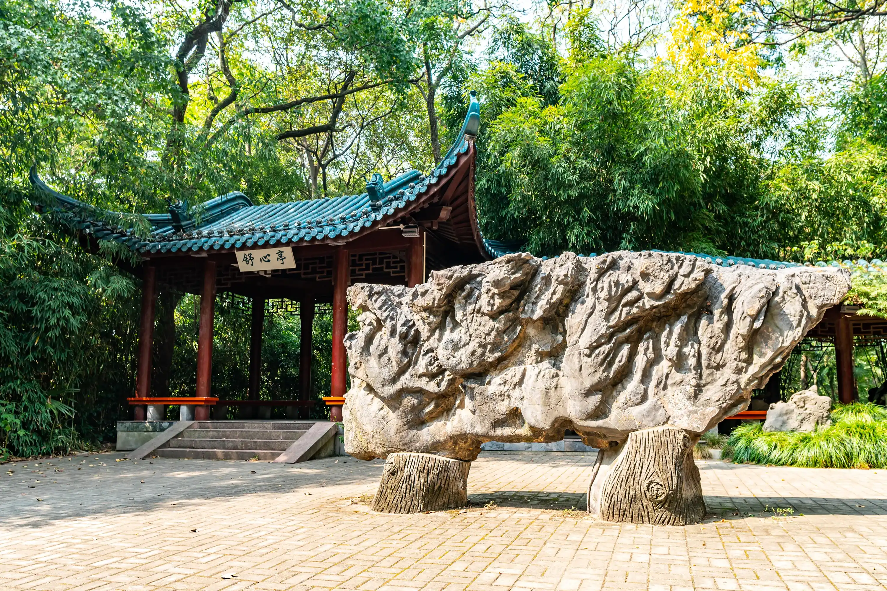 WUHU, CHINA - OCTOBER 2019: Anhui Zheshan Gongyuan Park Picturesque Shuxinting Pavilion Frontal View with Rock Sculpture WUHU, CHINA - OCTOBER 2019: Anhui Zheshan Gongyuan Park Picturesque Shuxinting Pavilion Frontal View with Rock Sculpture