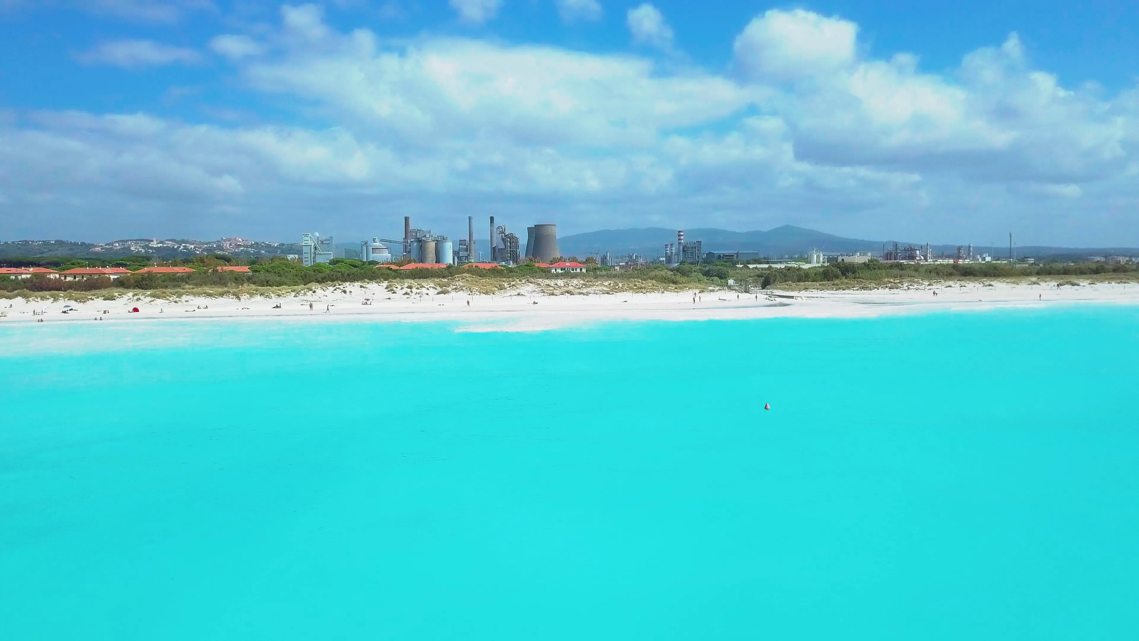 Aerial view. Rosignano Solvay Vada, Italy Rosignano Solvay Villas Castiglioncello, a white sandy beach and coastline overlooking the plant. Tuscany, Italy