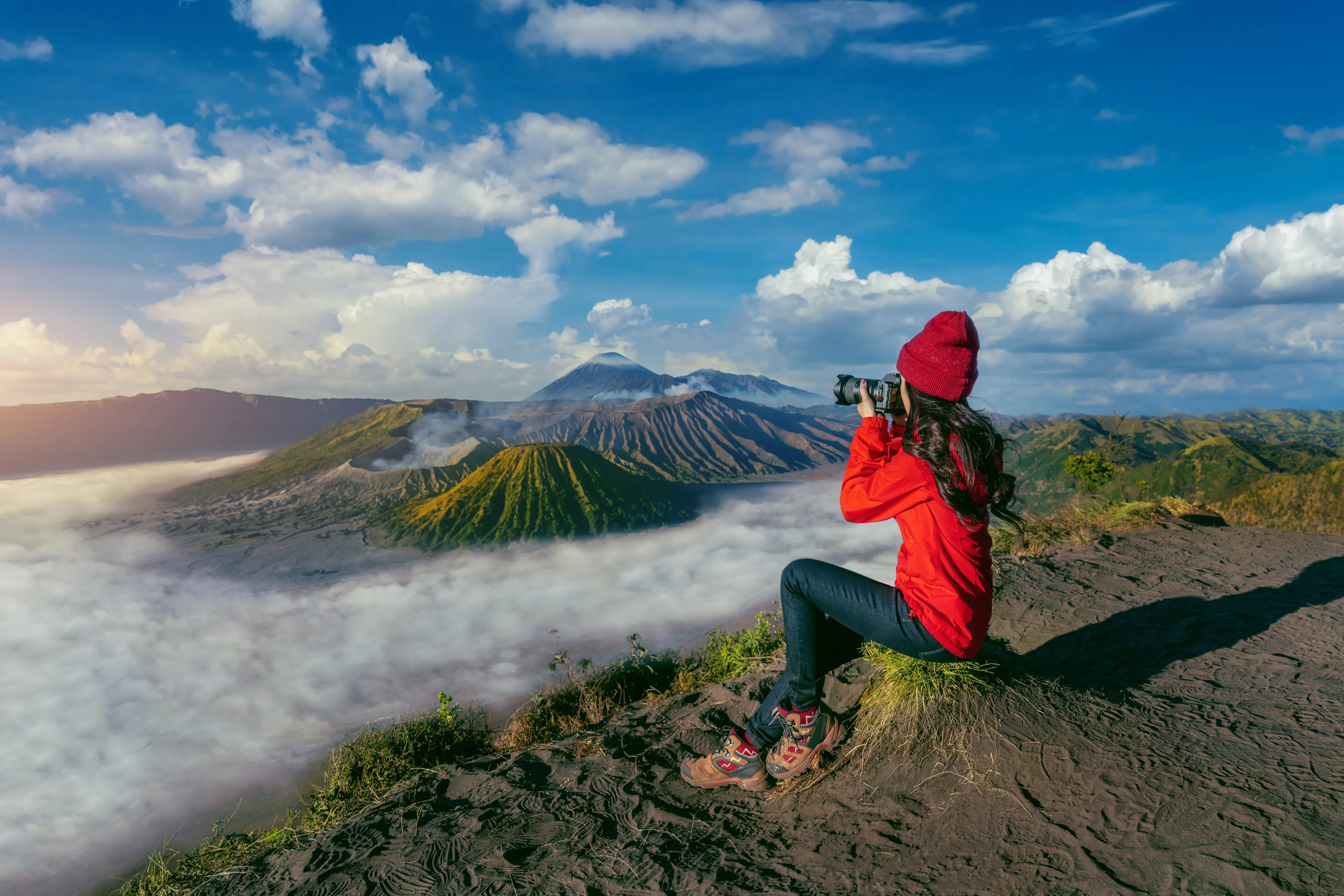 Tourist taking photo at Mount Bromo volcano (Gunung Bromo) in Bromo Tengger Semeru National Park, East Java, Indonesia.