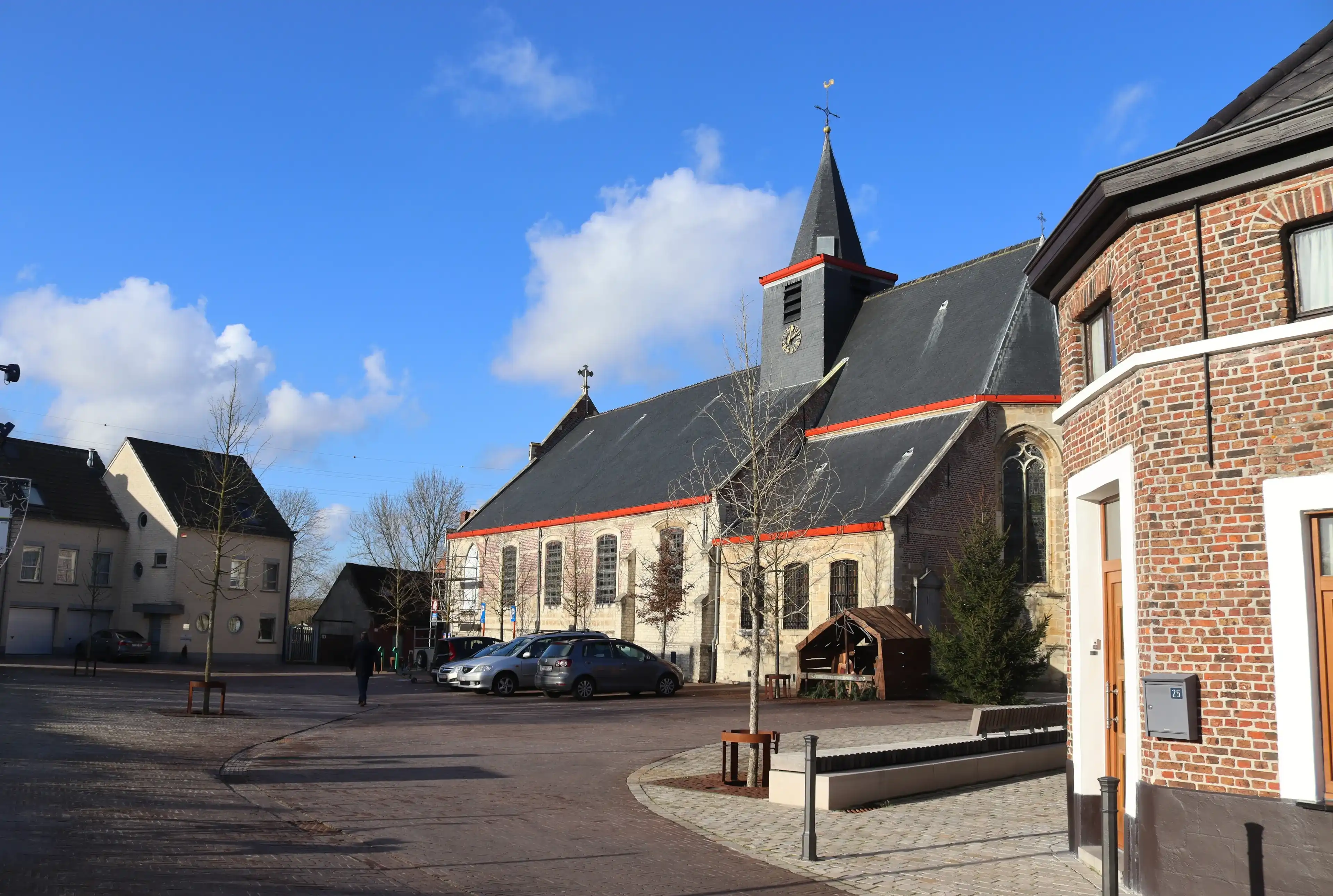 LEBBEKE, BELGIUM, 6 JANUARY 2022: The village center and church of Denderbelle near Lebbeke in Flanders. Denderbelle is a village in East Flanders next to the river Dender with a population of 2200. LEBBEKE, BELGIUM, 6 JANUARY 2022: The village center and church of Denderbelle near Lebbeke in Flanders. Denderbelle is a village in East Flanders next to the river Dender with a population of 2200.