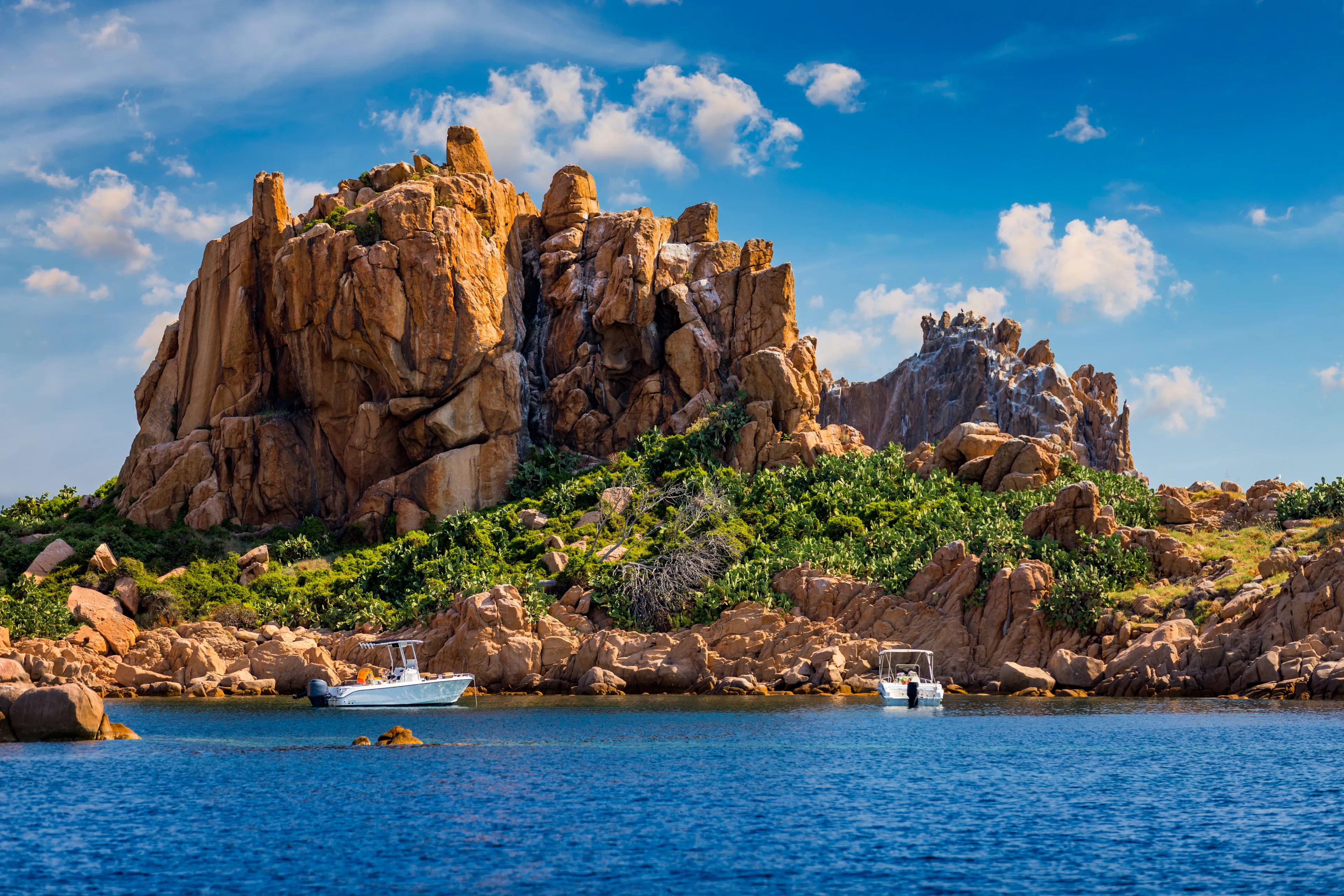 View of Isola dell'Ogliastra, small island close to the shore of Sardinia. Isola dell’Ogliastra, 47m high, lies 3 miles South of Punta Pedra Longa and is in front of Lotzorai beach, Sardinia, Italy