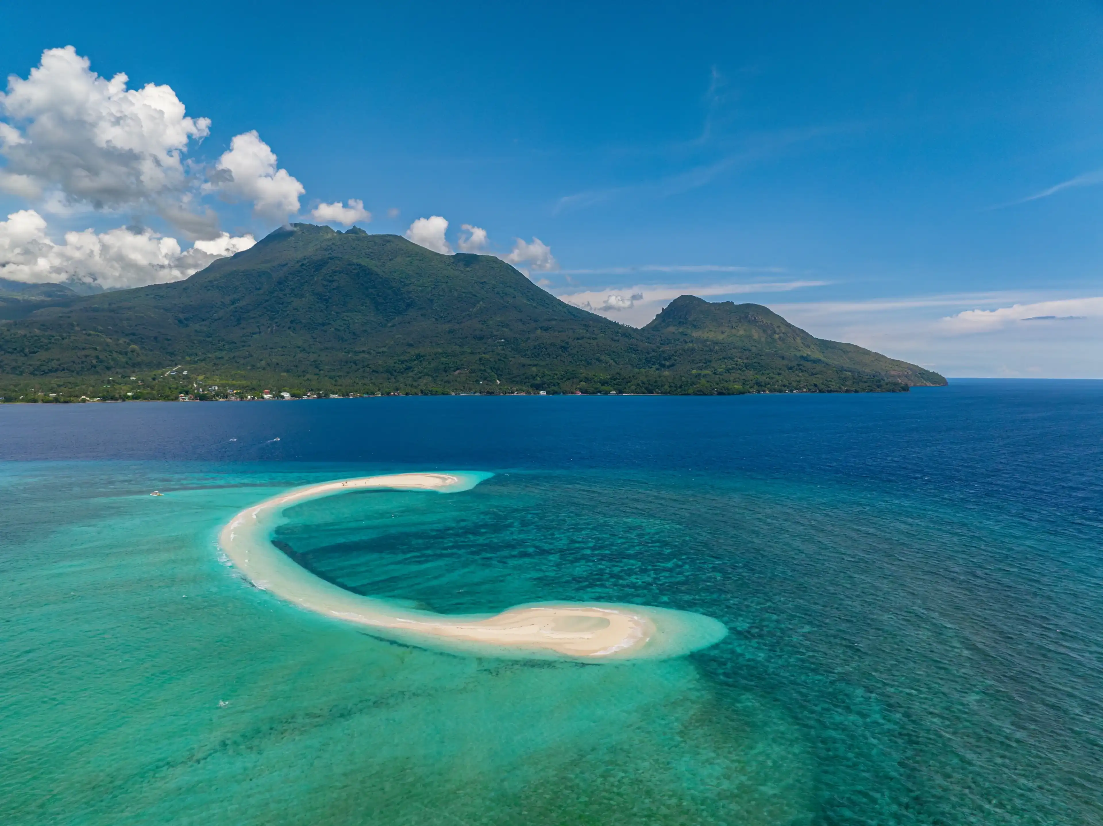 Aerial view of white sandbar with ocean waves in White Island. Camiguin Island.Philippines. Aerial view of white sandbar with ocean waves in White Island. Camiguin Island.Philippines.