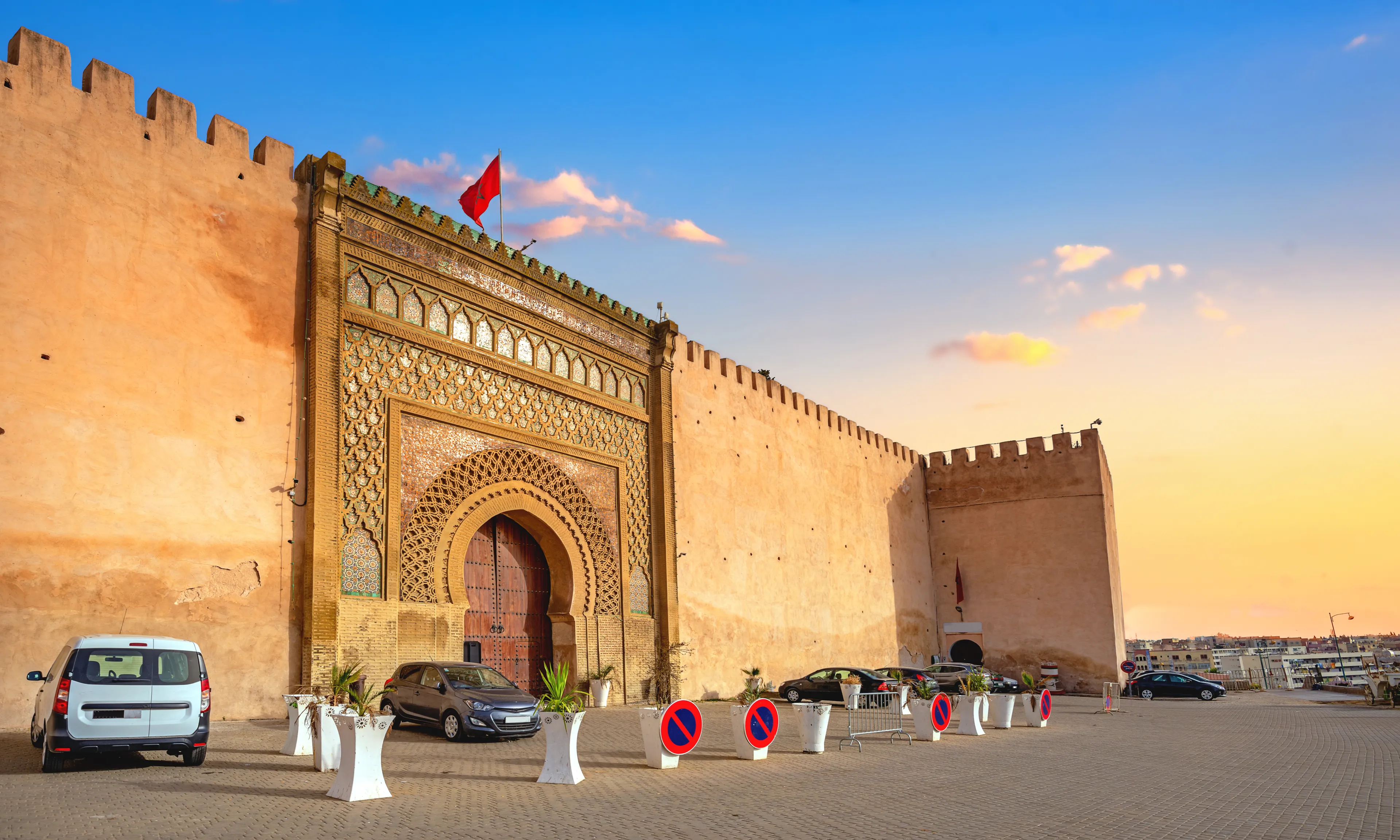 View of El Hedim square with ancient gate Bab El-Mansour and ancient walls in Meknes. Morocco, North Africa