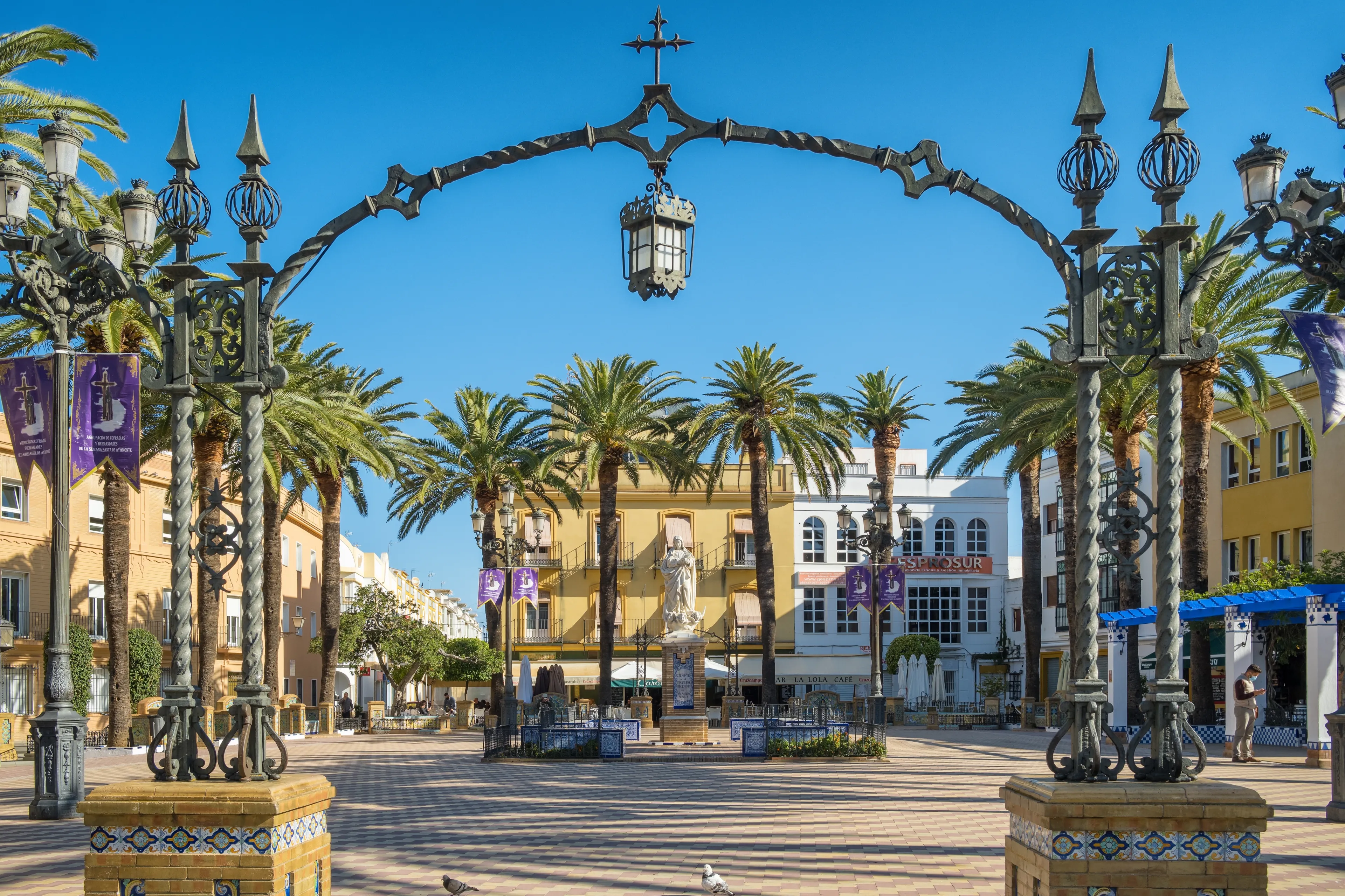 Ayamonte, Spain - April 20, 2022: Statue of the Immaculate Conception in the Plaza de la Laguna in Ayamonte town, Huelva Province, Andalucia, Spain