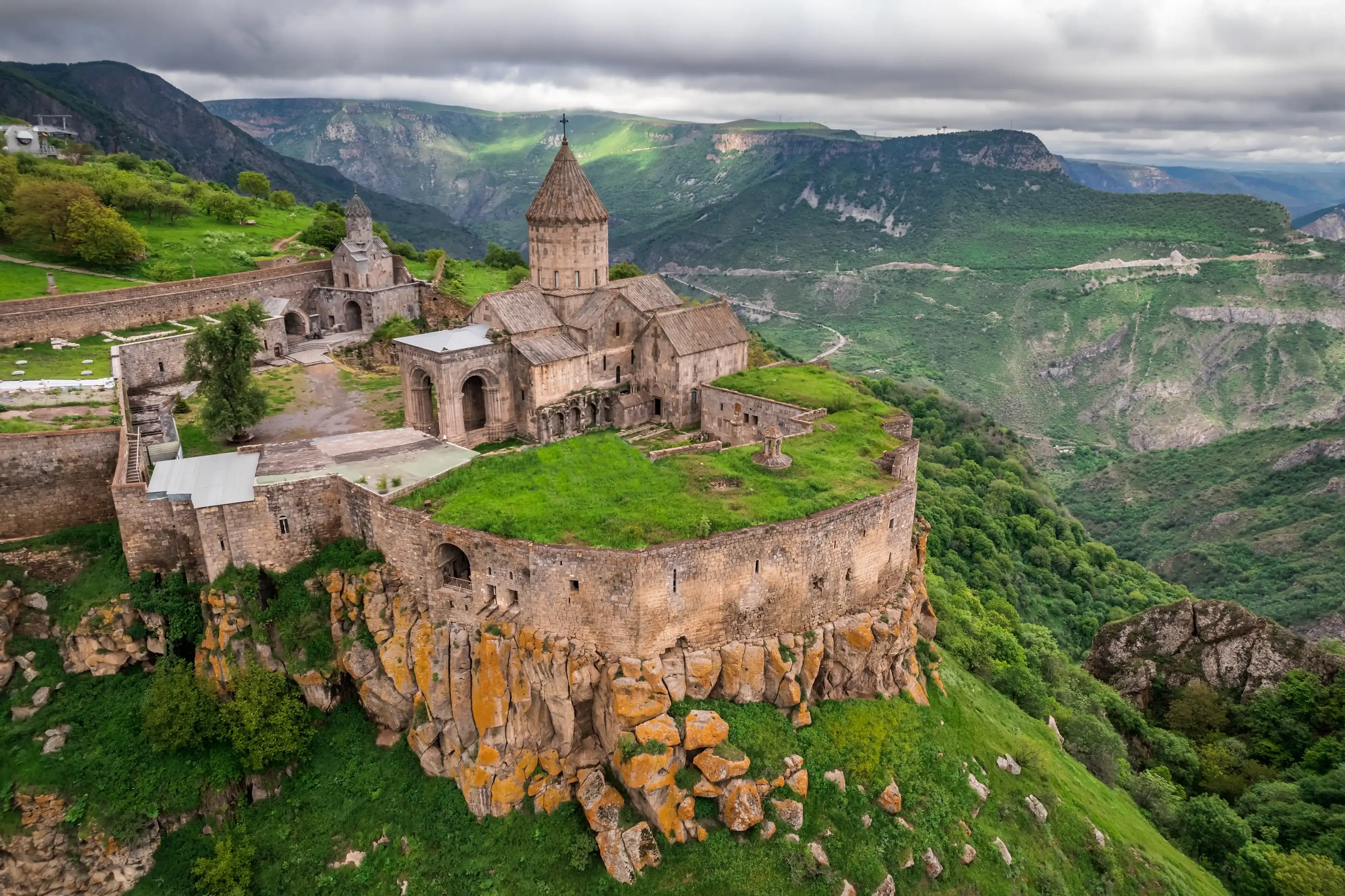 Tatev Monastery is a 9th-century Armenian Apostolic monastery located on a large basalt plateau near the village of Tatev in the Syunik Province in southeastern Armenia. Tatev Monastery is a 9th-century Armenian Apostolic monastery located on a large basalt plateau near the village of Tatev in the Syunik Province in southeastern Armenia.
