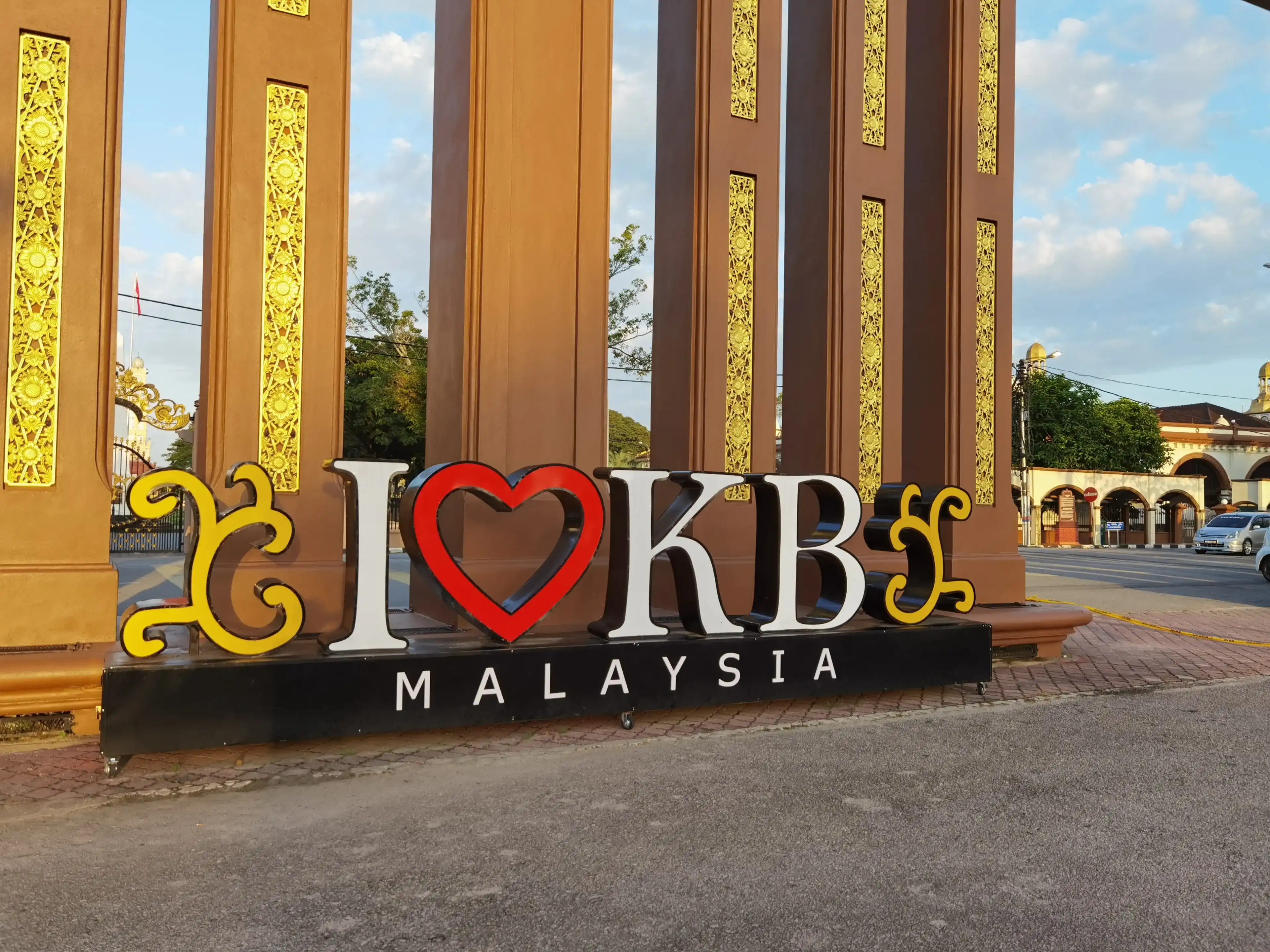 Kota Bharu, Kelantan, Malaysia. 29th December 2020. Nice looking promotional signage behind a iconic wooden arch. Kota Bharu, Kelantan, Malaysia. 29th December 2020. Nice looking promotional signage behind a iconic wooden arch.