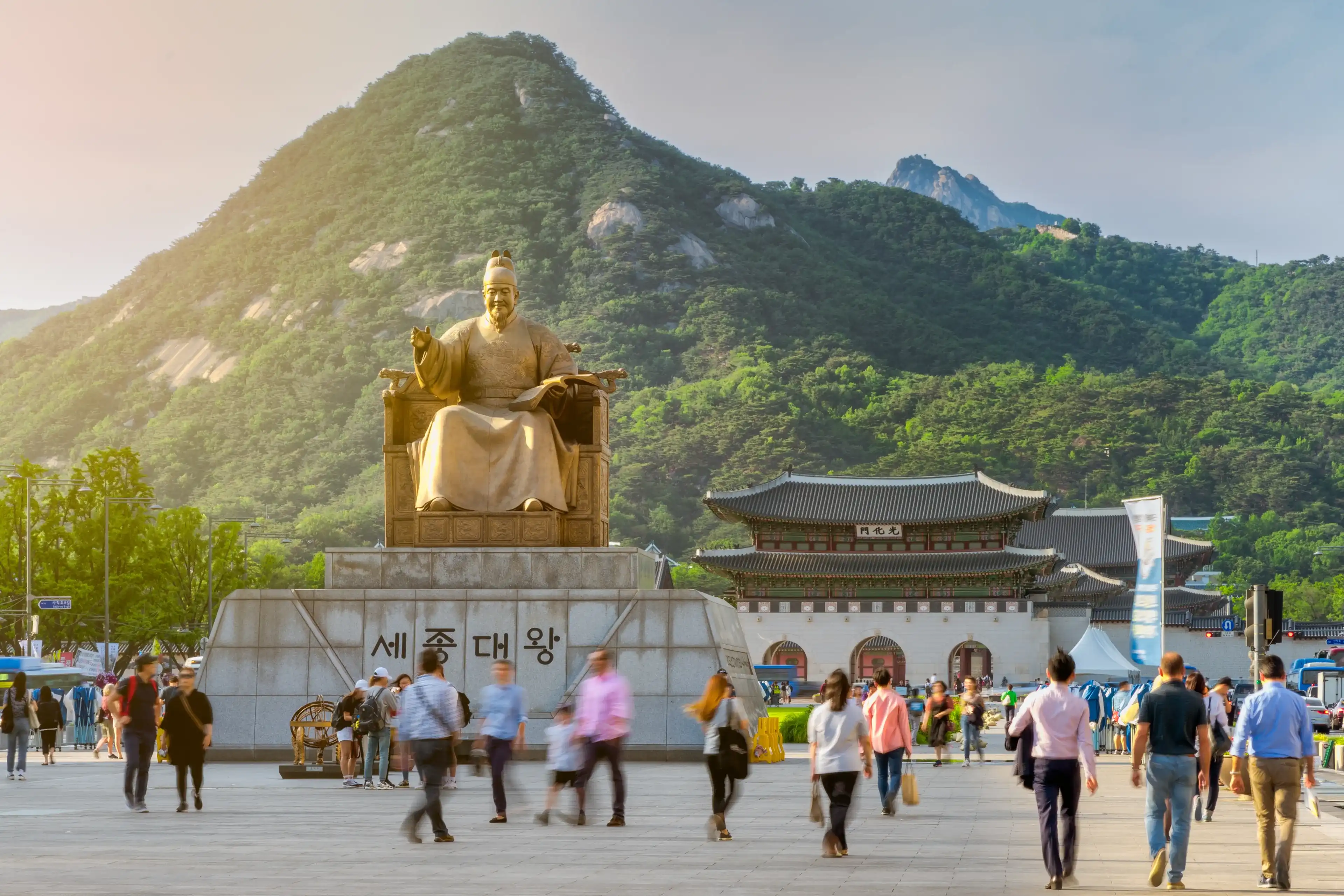 King Sejong Statue in Gwanghwamun Plaza with Gwanghwamun Gate in background King Sejong Statue in Gwanghwamun Plaza with Gwanghwamun Gate in background