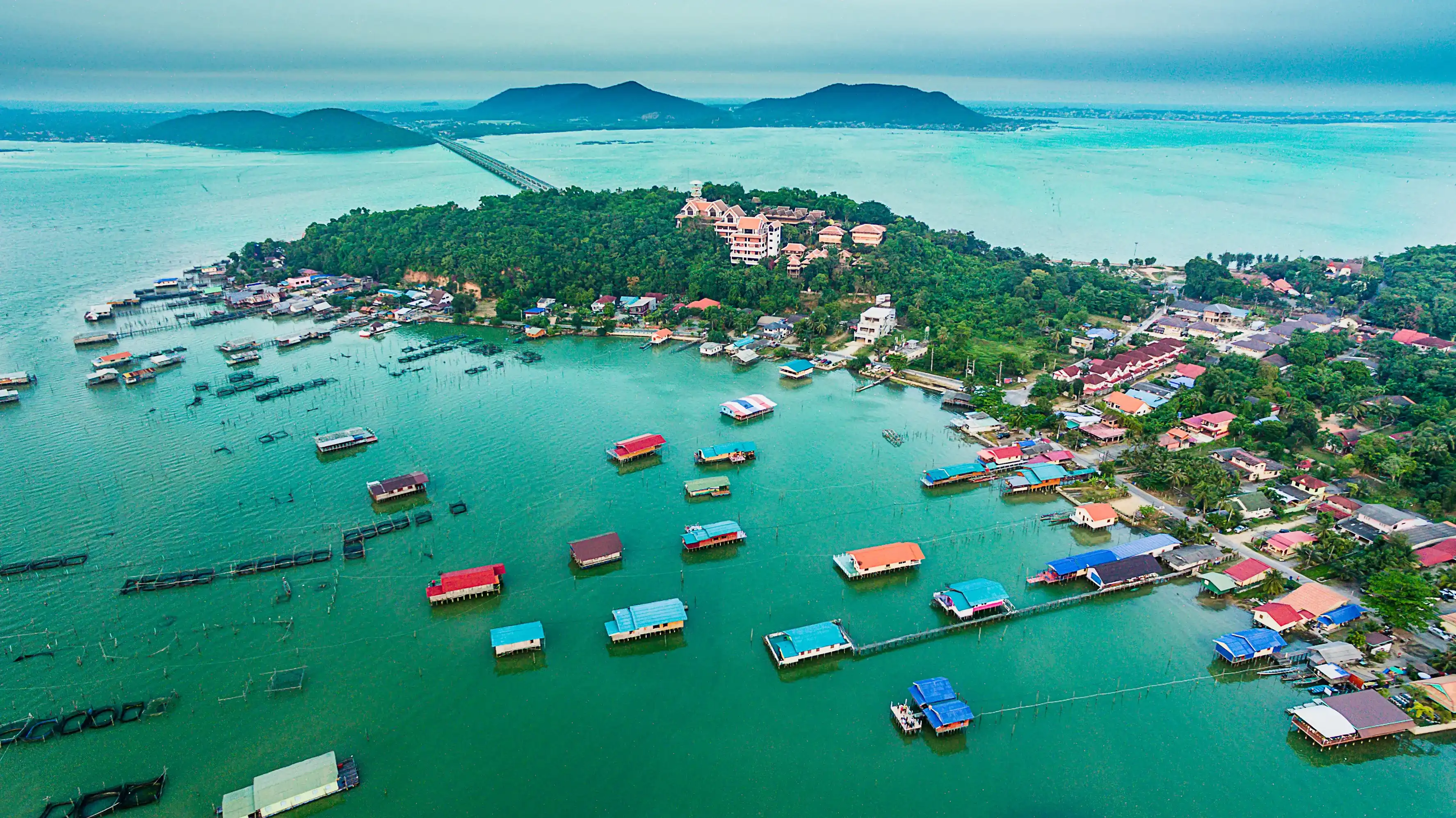 View of wooden house on the lake with island, Songkhla lake, Koh Yo island, Songkhla province,Thailand, Top view from drone View of wooden house on the lake with island, Songkhla lake, Koh Yo island, Songkhla province,Thailand, Top view from drone
