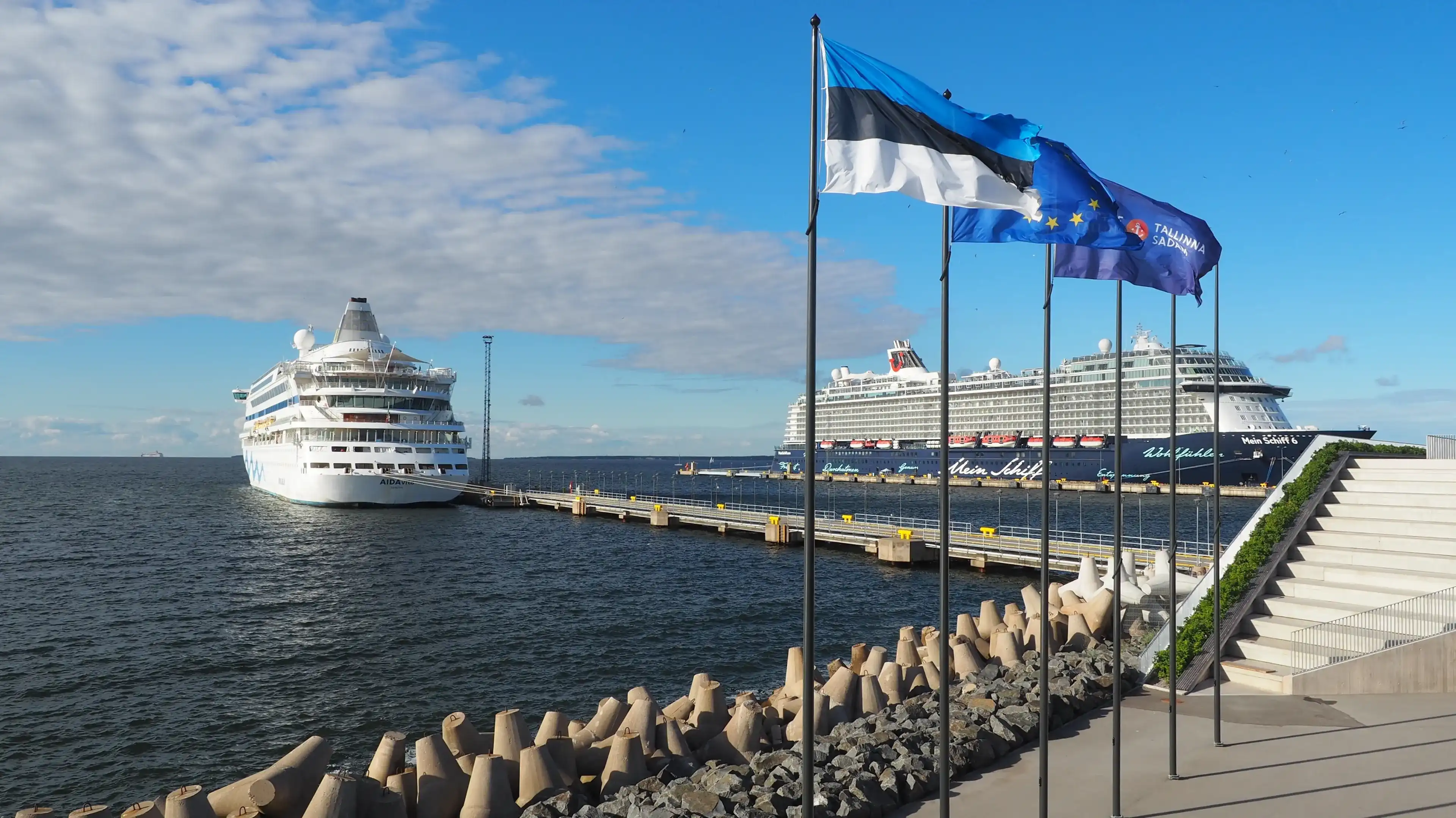 Tallinn, Estonia, 07-28-2022: sea passenger port, cruise ships at the pier, flags of Estonia, the European Union and the Port of Tallinn Tallinn, Estonia, 07-28-2022: sea passenger port, cruise ships at the pier, flags of Estonia, the European Union and the Port of Tallinn