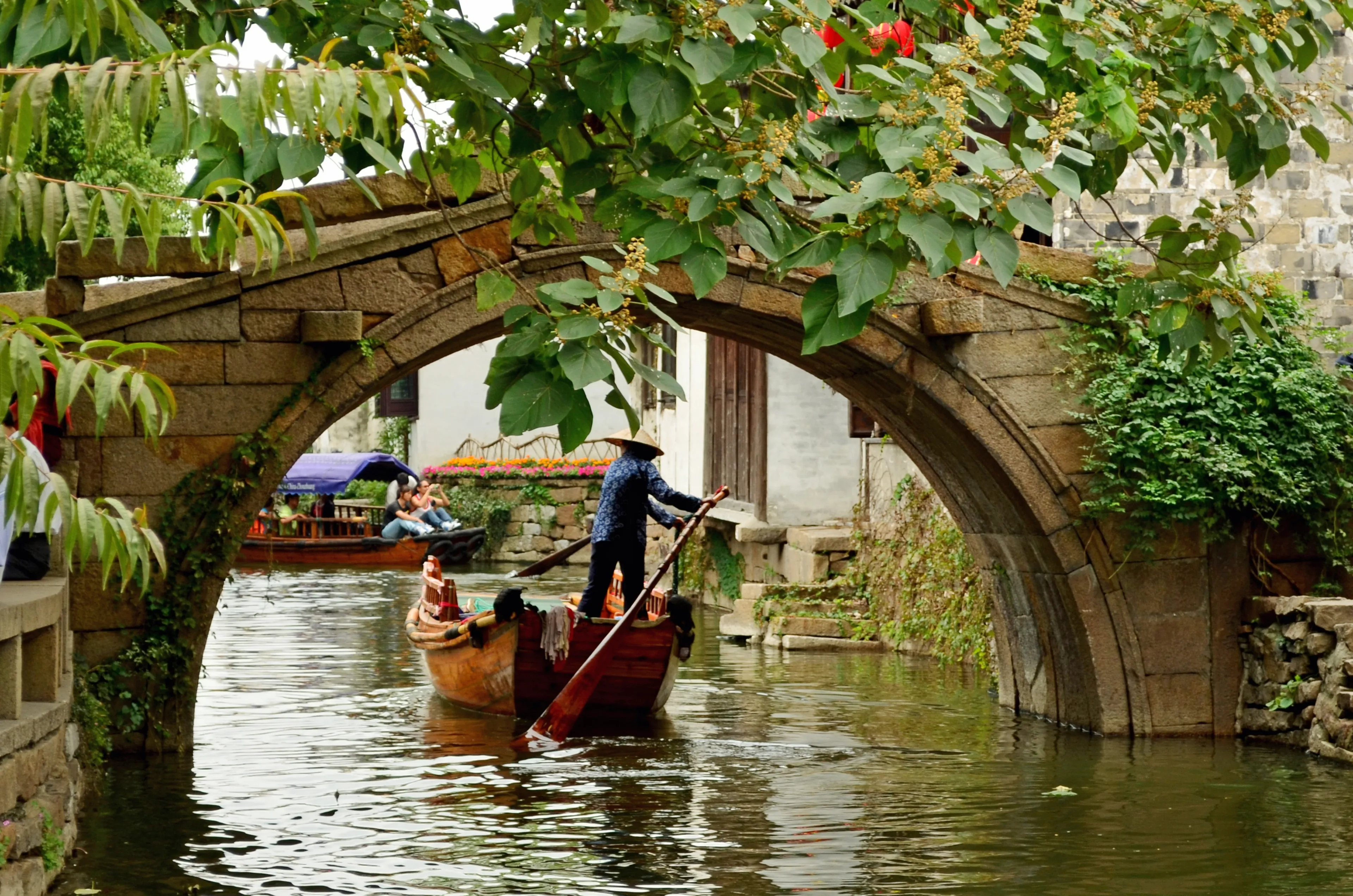 Zhouzhuang, Kunshan, Suzhou, Jiangsu, China - 9,27,2011: Historic Buildings, Boat and Bridge on Grand Canal