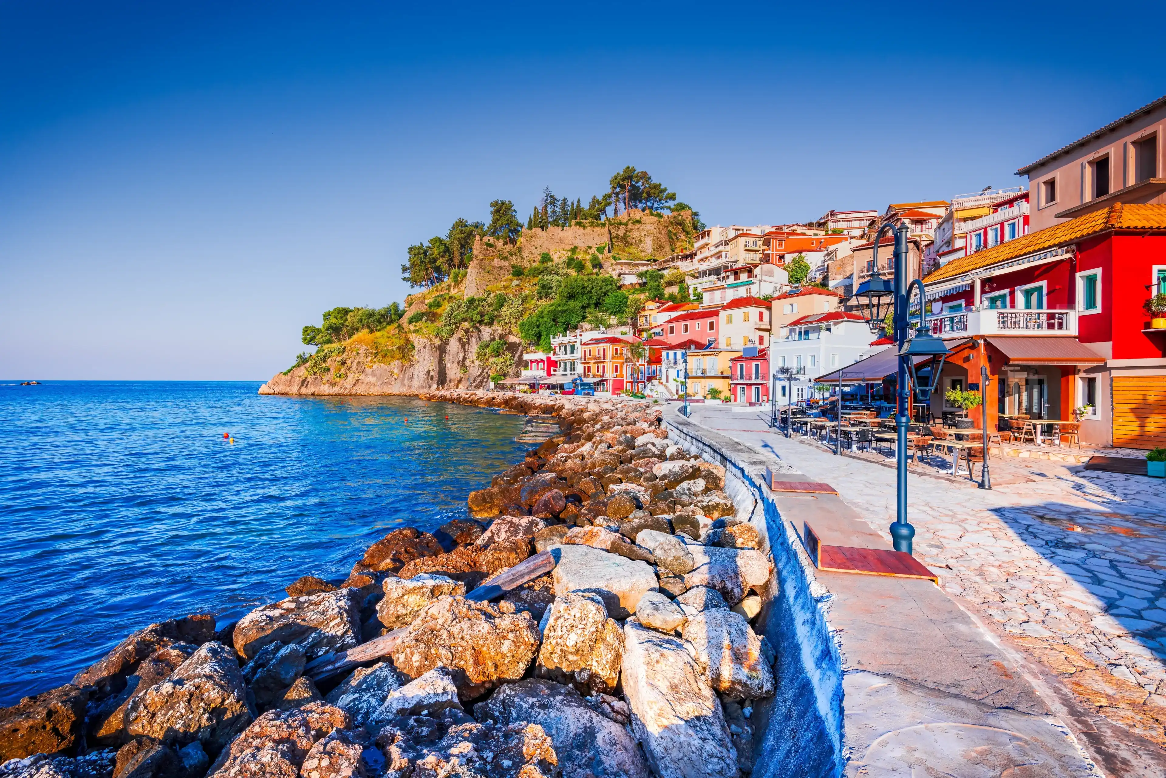 Parga, Greece. Picturesque coastal town, stunning golden hour, historical charm, and a vibrant summer atmosphere. Parga, Greece. Picturesque coastal town, stunning golden hour, historical charm, and a vibrant summer atmosphere.