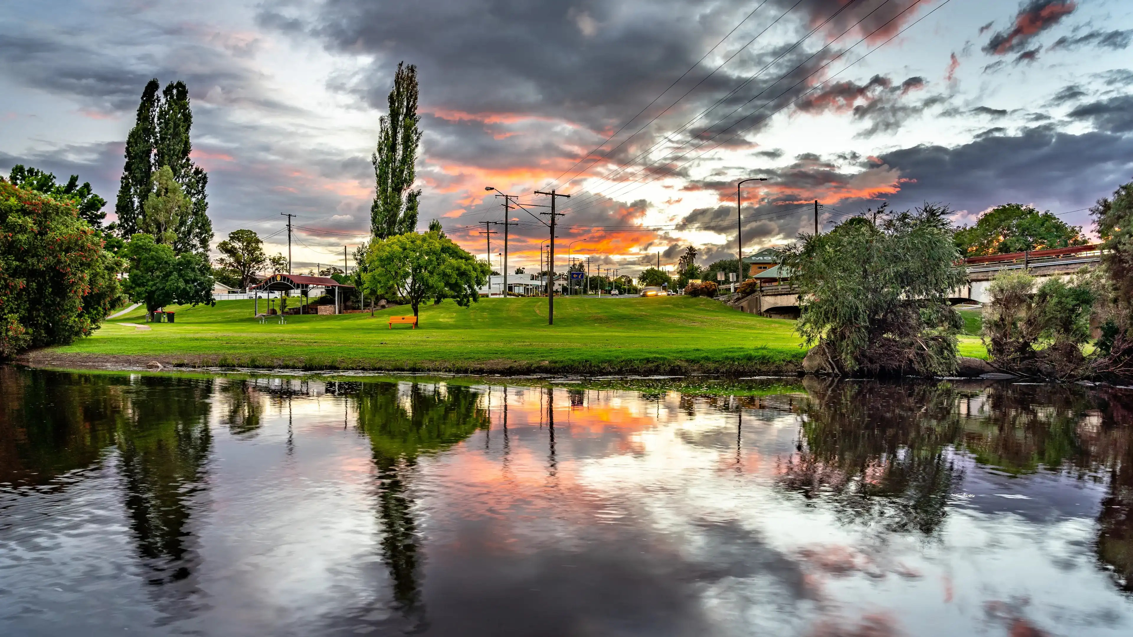 Stanthorpe, Queensland, Australia - Jan 4, 2022: Picturesque view over the Quart Port creek at sunset Stanthorpe, Queensland, Australia - Jan 4, 2022: Picturesque view over the Quart Port creek at sunset