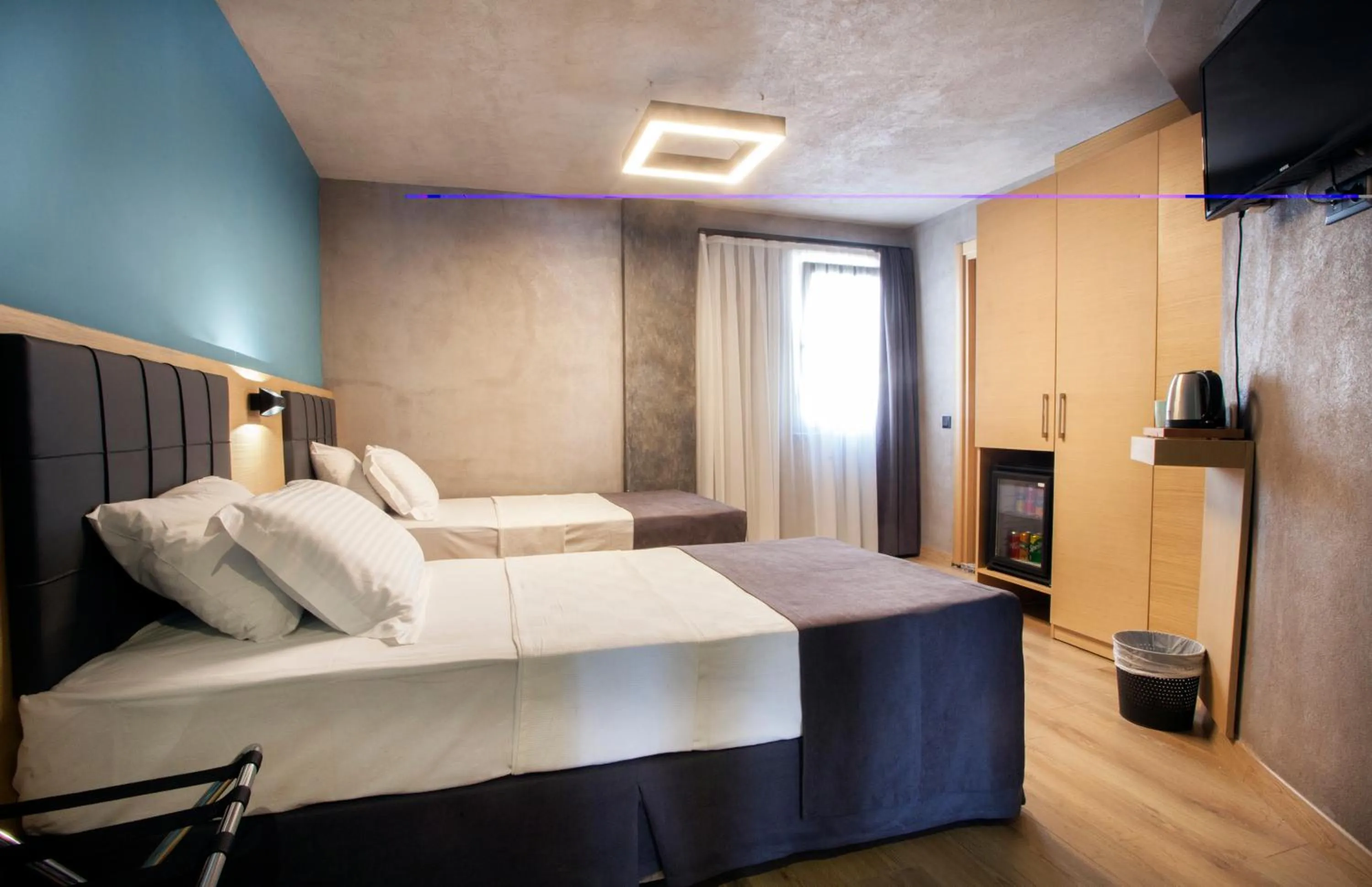 Bed in Red Stone Hotel