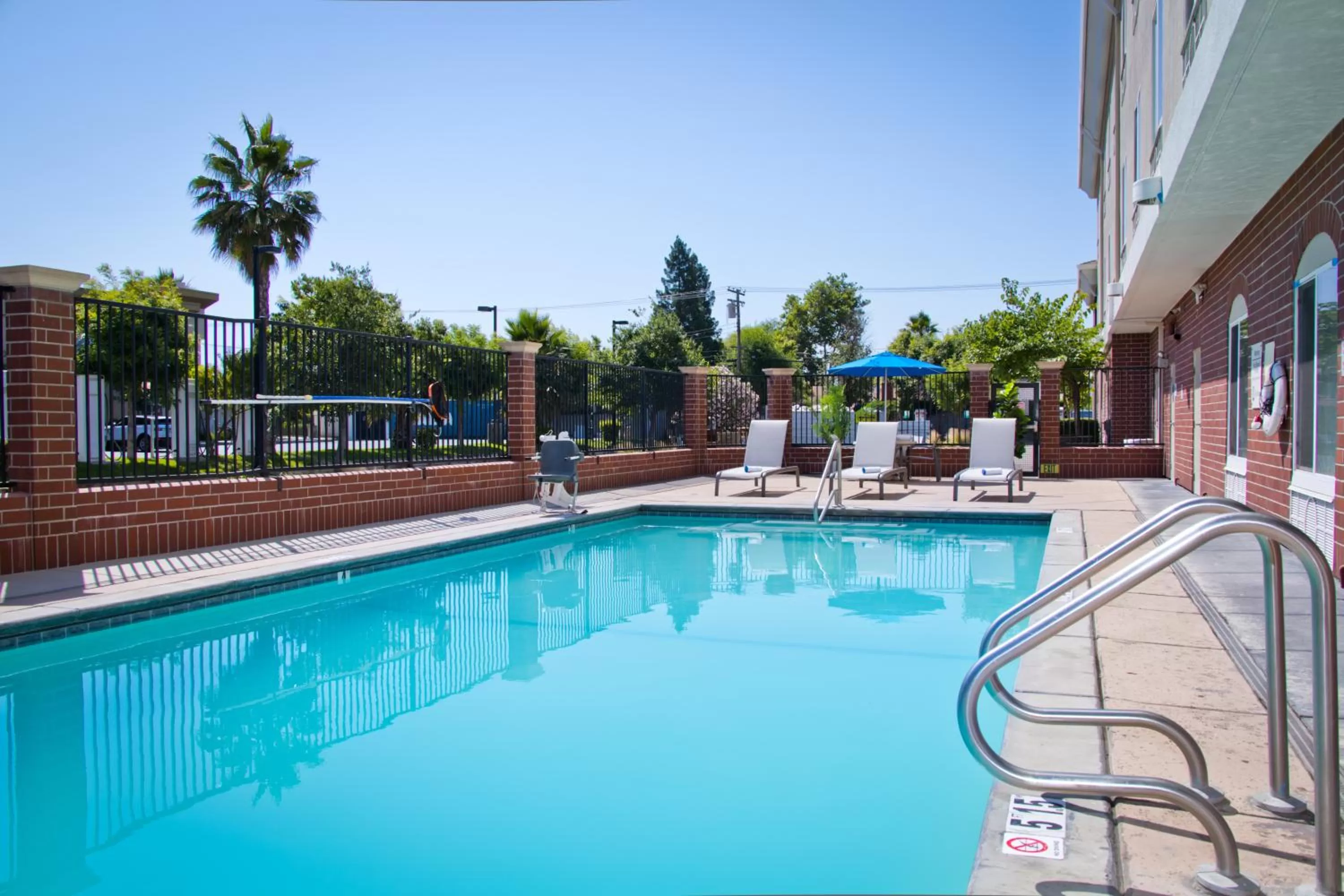Pool view in Holiday Inn Express & Suites Sacramento NE Cal Expo by IHG