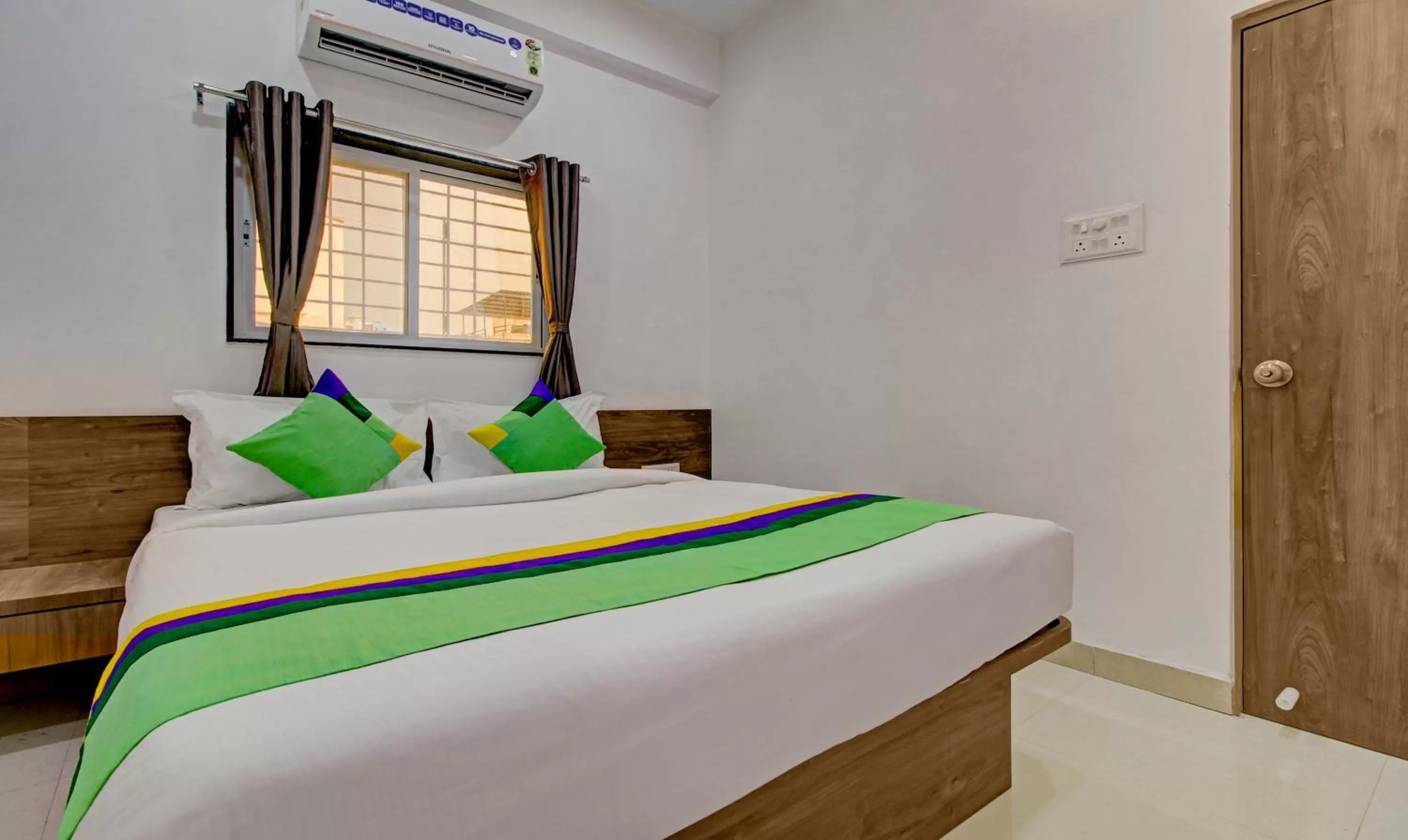 Bed in Treebo Trend White House